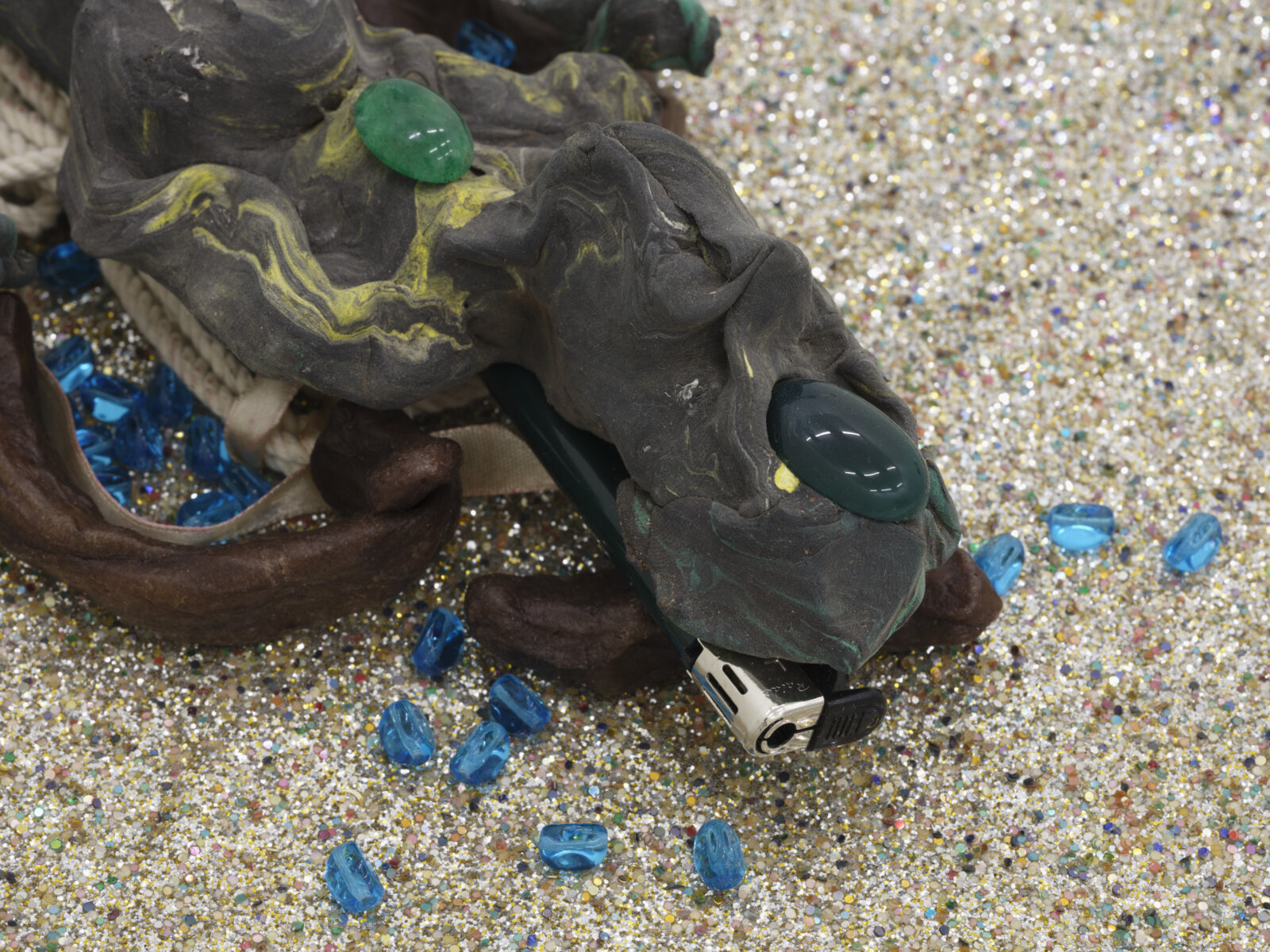 Christina Mackie, Green Figure (detail), 2006, modeling clay, green onyx, lighters, wax, rope, paint in seashell, glass beads, fabric and bamboo, 36 x 12 in. (92 x 30 cm)