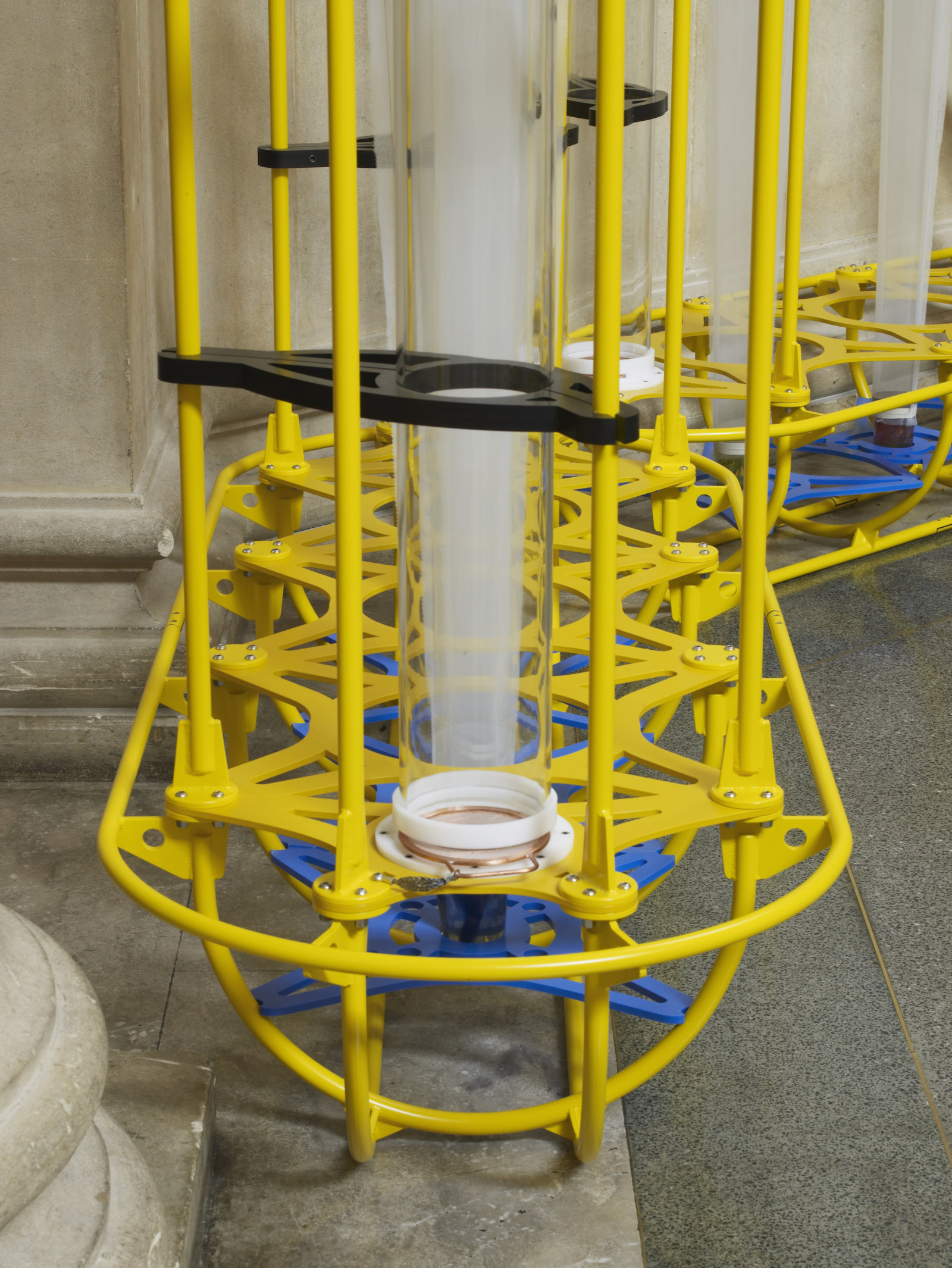 Christina Mackie, The Yellow Machines (detail), 2015, steel, aluminum, acrylic, styrene, copper, stainless steel, nylon webbing, polyethylene, nylon, resin, rubber, 128 x 160 x 32 in. (326 x 406 x 80 cm). Installation view, the filters, Tate Britain, London, UK, 2015