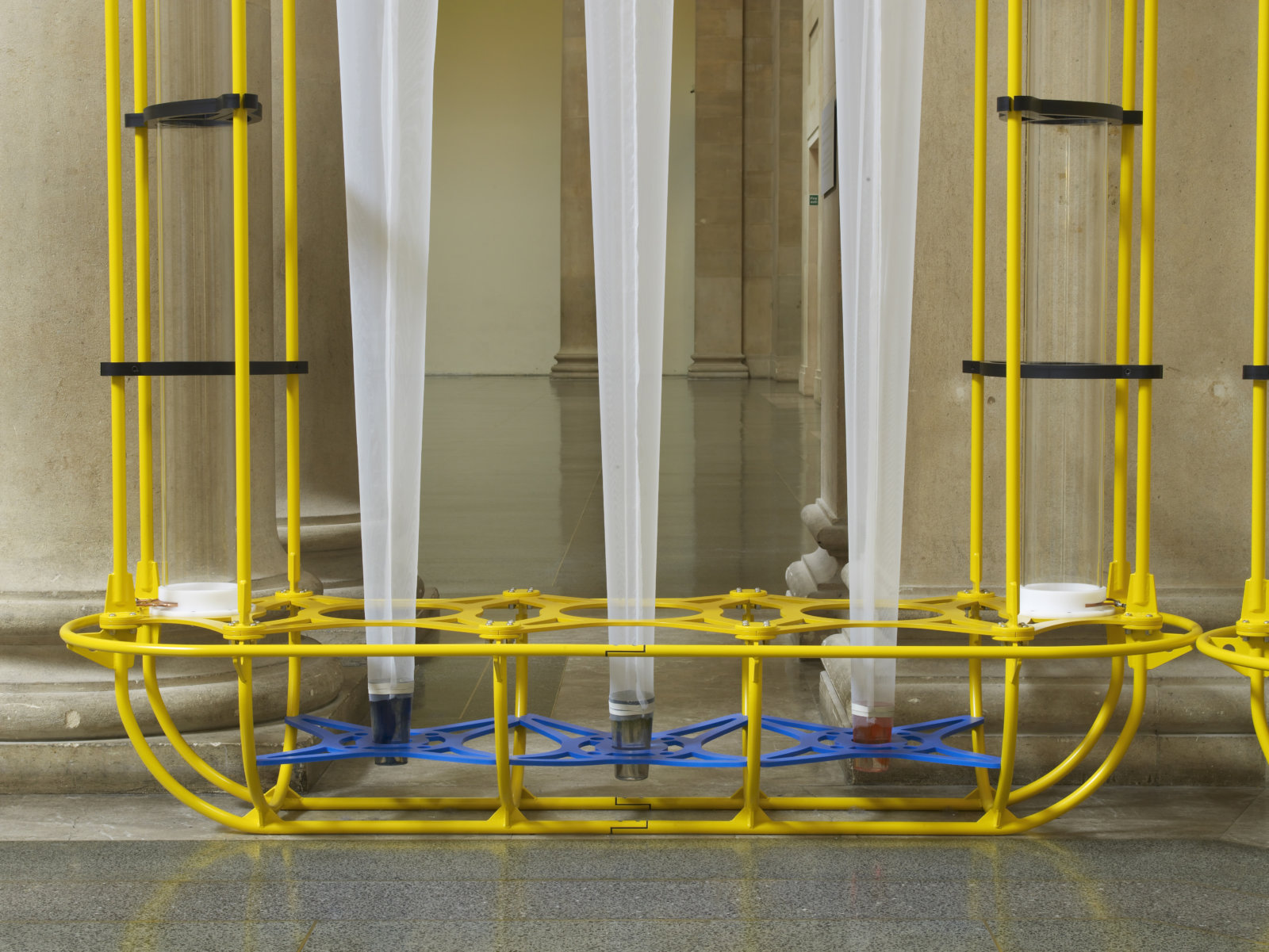 Christina Mackie, The Yellow Machines (detail), 2015, steel, aluminum, acrylic, styrene, copper, stainless steel, nylon webbing, polyethylene, nylon, resin, rubber, 128 x 160 x 32 in. (326 x 406 x 80 cm). Installation view, the filters, Tate Britain, London, UK, 2015