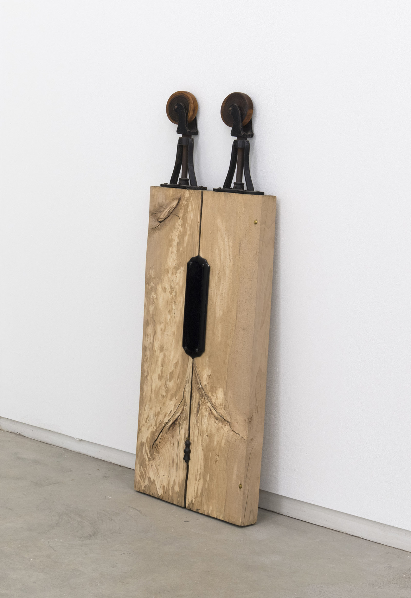 Christina Mackie, Trestle Person III, 2012, cast iron, wood, ceramics, brass, 46 x 16 x 3 in. (116 x 39 x 6 cm)