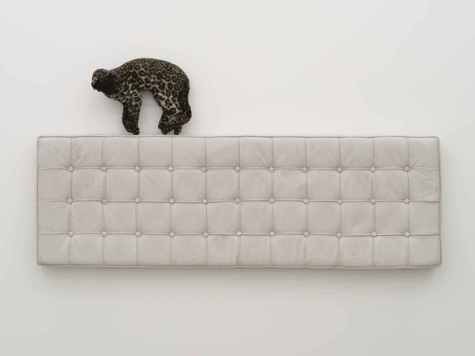 Liz Magor, Arch, 2025, polymerized gypsum, synthetic fur, 35 x 70 x 9 in. (89 x 178 x 23 cm)