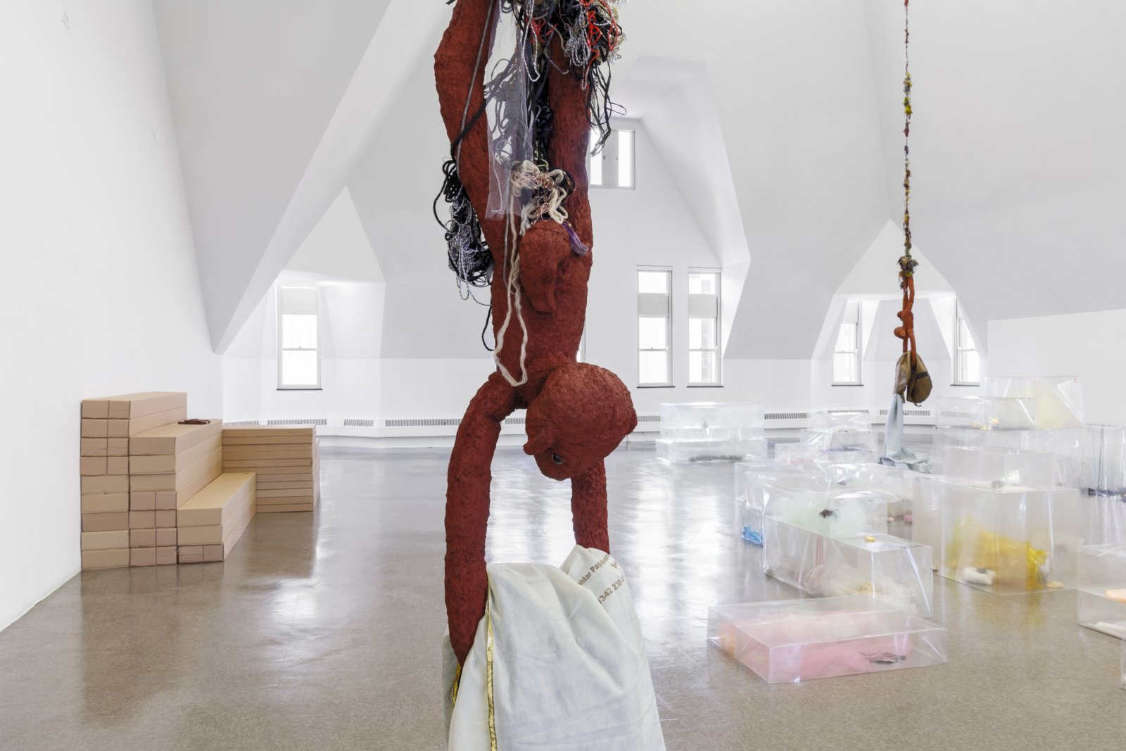 Liz Magor, Delivery (red) (detail), 2018, silicone rubber, textiles, twine, 144 x 24 x 13 in. (366 x 61 x 32 cm). Installation view, BLOWOUT, The Renaissance Society, Chicago, USA, 2019