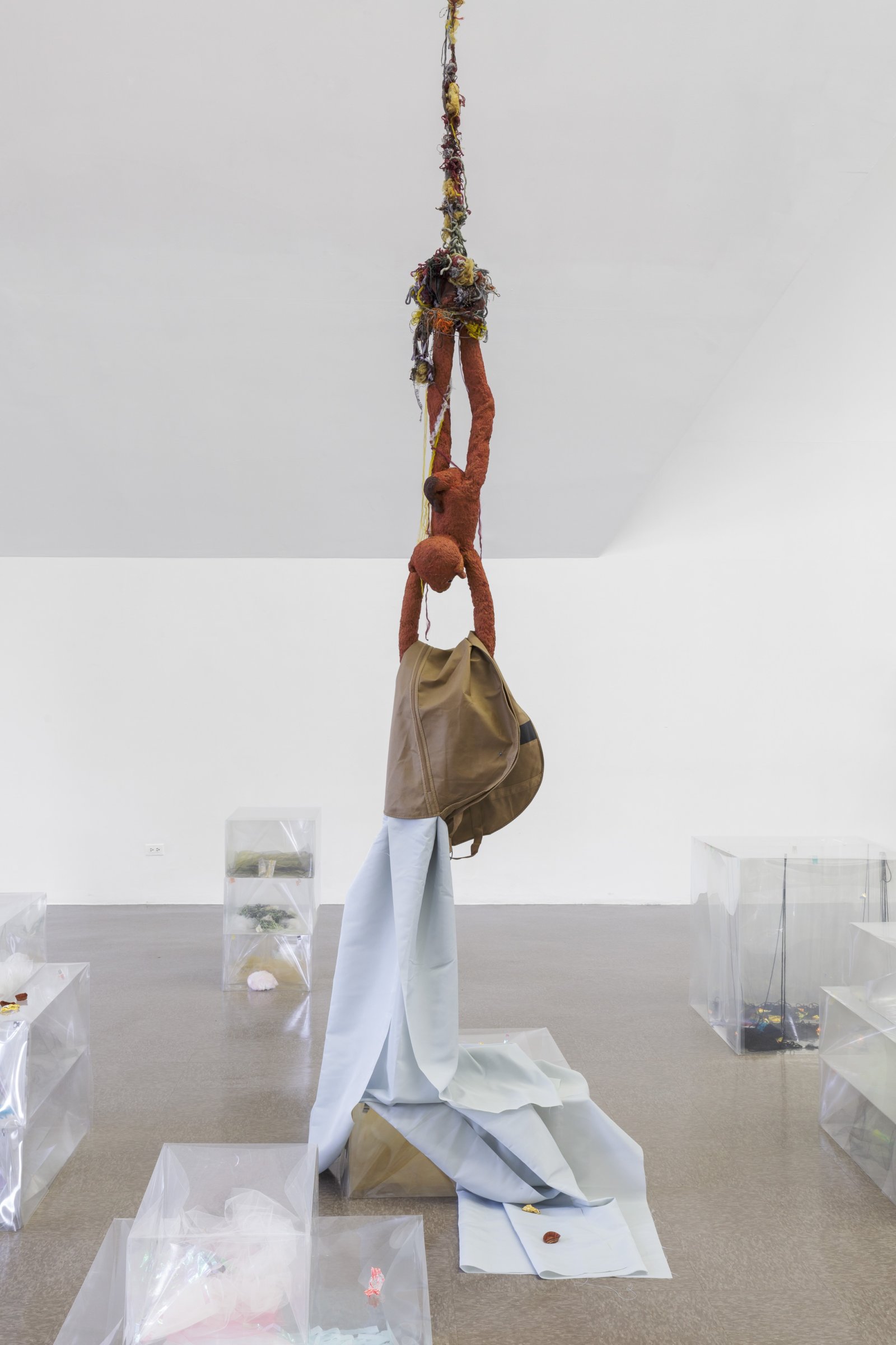 Liz Magor, Delivery (sienna), 2018, silicone rubber, textiles, twine, polyester film, yellow tulle, 144 x 20 x 14 in. (366 x 51 x 34 cm). Installation view, BLOWOUT, The Renaissance Society, Chicago, USA, 2019