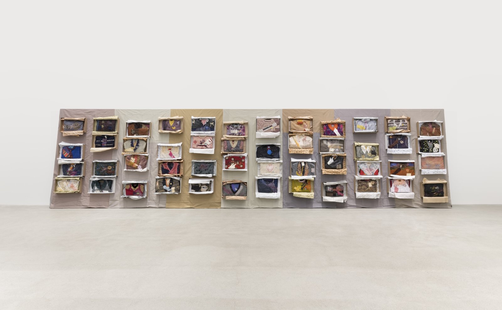 Liz Magor, Being This, 2012–2019, paper, textiles, found materials, 96 x 432 x 22 in. (244 x 1097 x 56 cm)