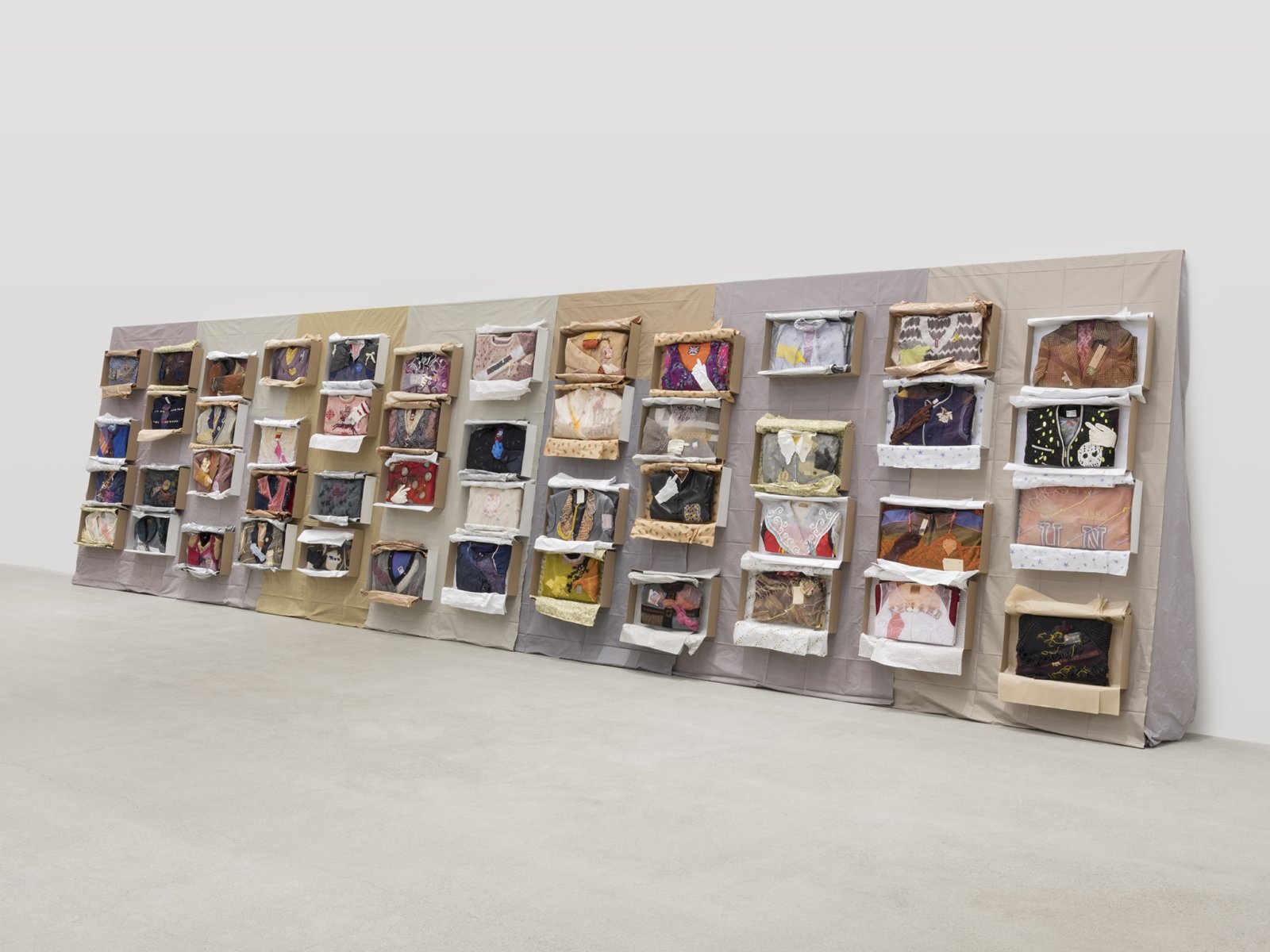 Liz Magor, Being This, 2012–2019, paper, textiles, found materials, 96 x 432 x 22 in. (244 x 1097 x 56 cm)