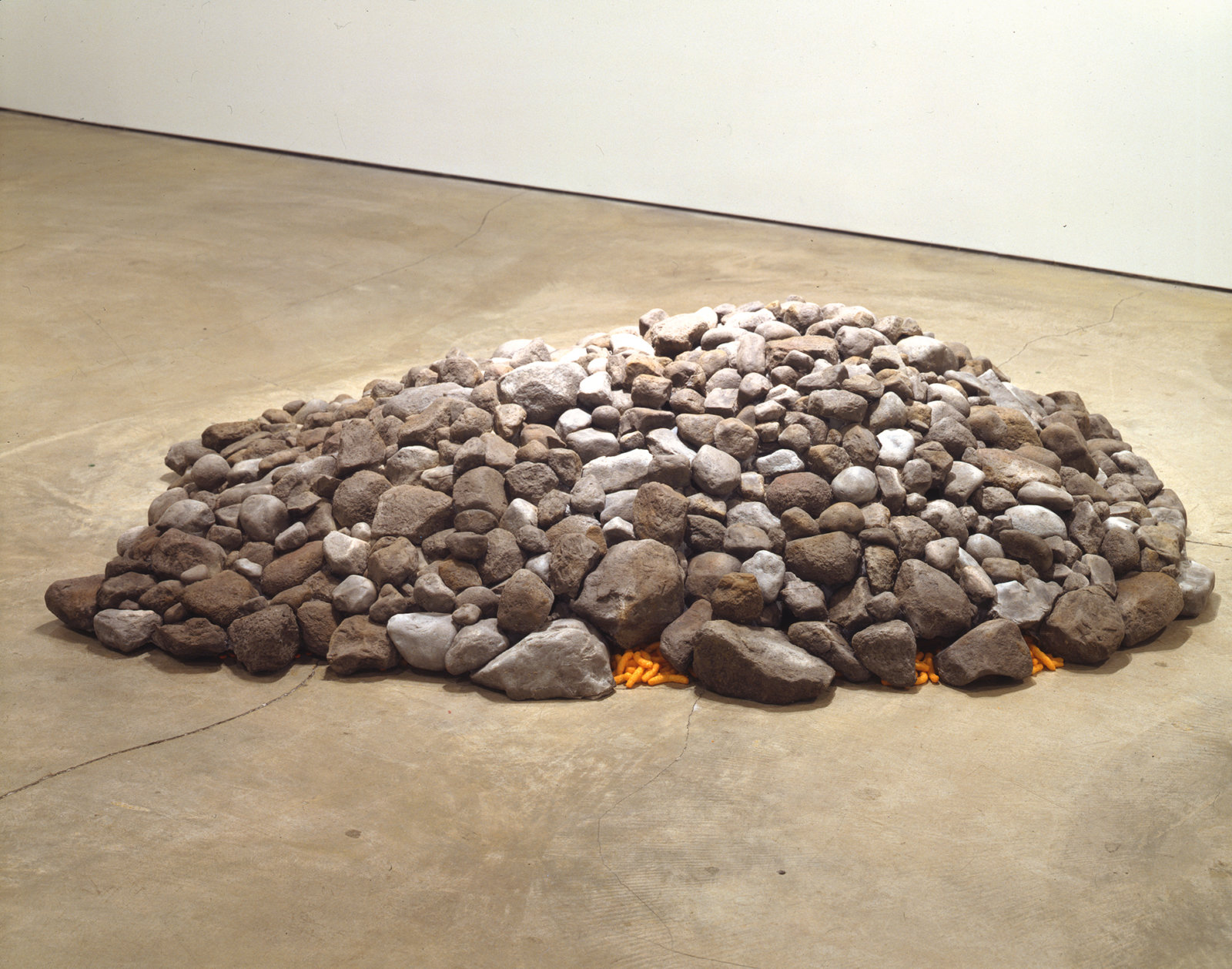 Liz Magor, Chee-to, 2000, polymerized gypsum, food, 17 x 79 x 66 in. (42 x 200 x 167 cm)