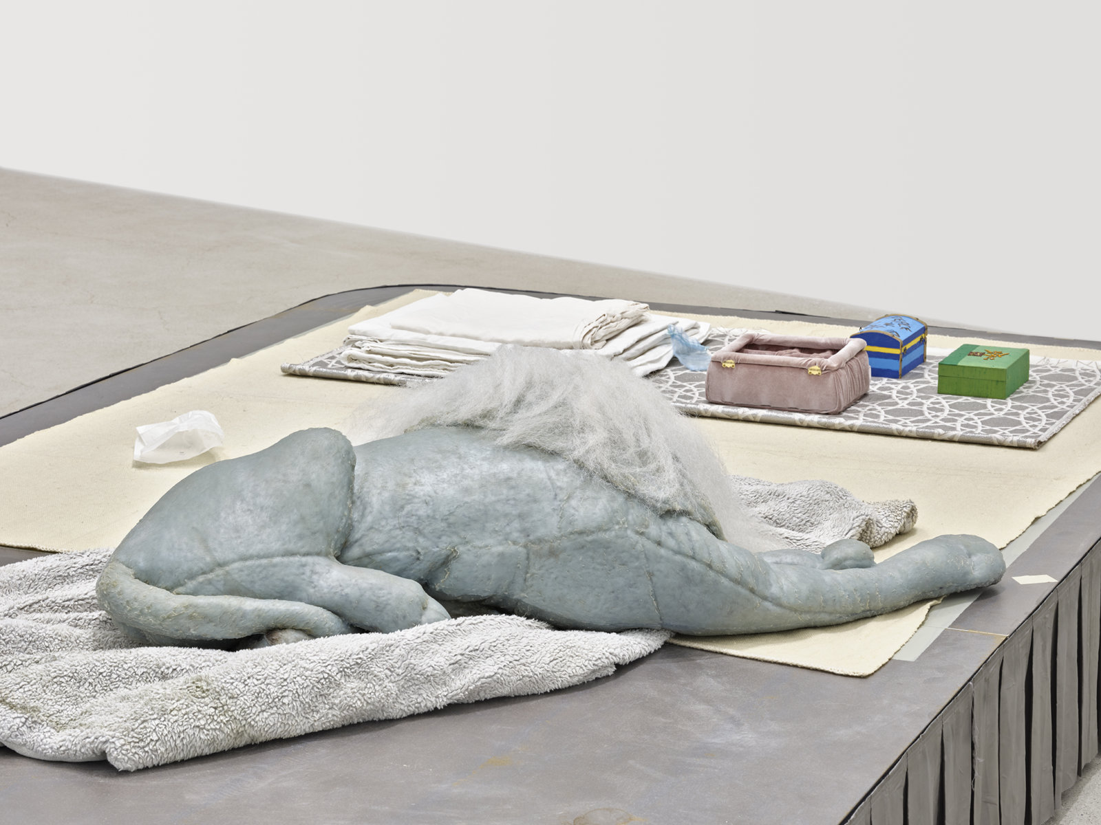 Liz Magor, Coiffed (detail), 2020, painted plywood, fabric skirting, silicone rubber, artificial hair, acrylic throw, woollen blankets, silver fabric, linen, jewellery boxes, costume jewellery, packaging materials, 27 x 132 x 96 in. (69 x 335 x 244 cm)