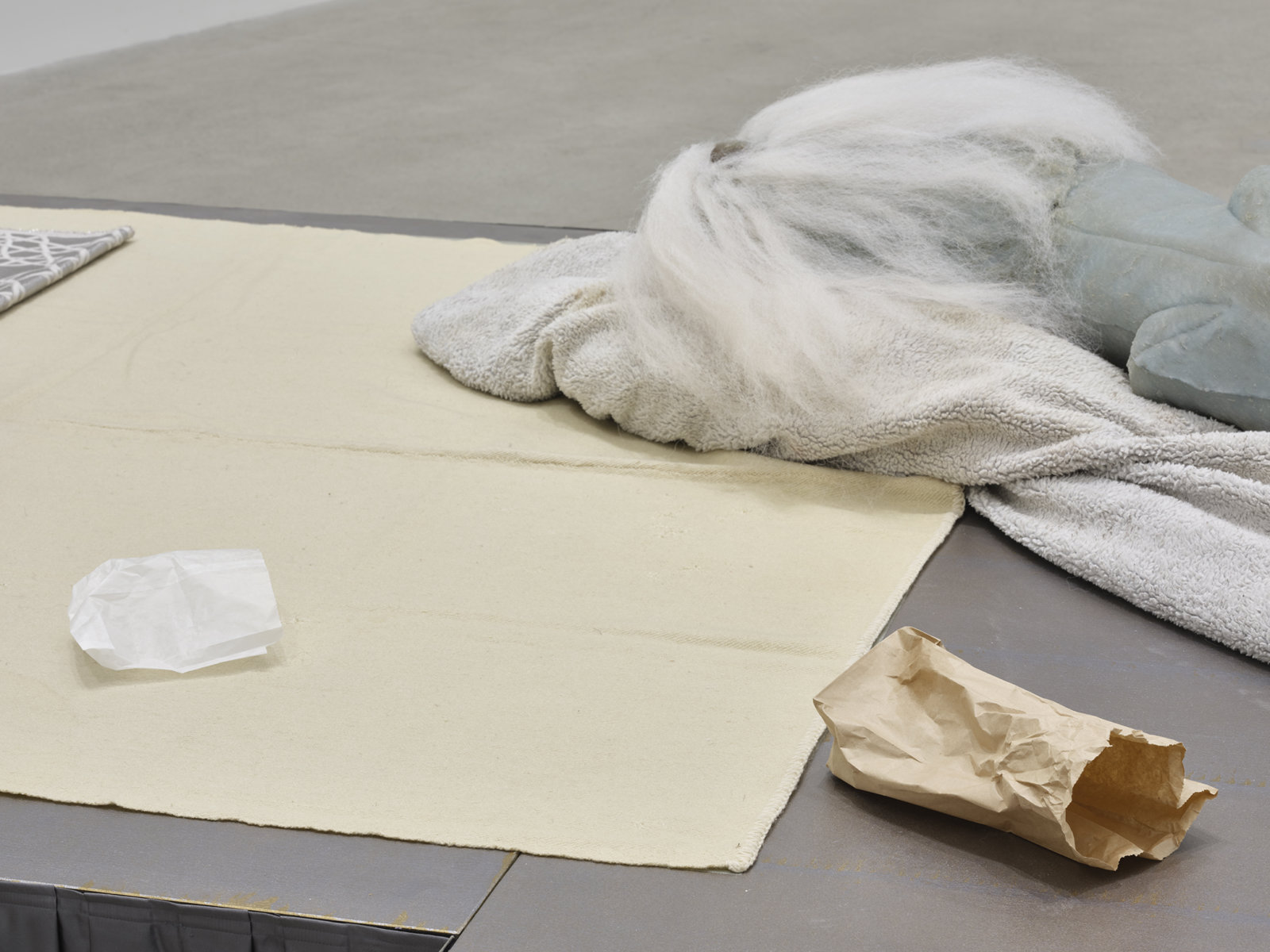 Liz Magor, Coiffed (detail), 2020, painted plywood, fabric skirting, silicone rubber, artificial hair, acrylic throw, woollen blankets, silver fabric, linen, jewellery boxes, costume jewellery, packaging materials, 27 x 132 x 96 in. (69 x 335 x 244 cm)