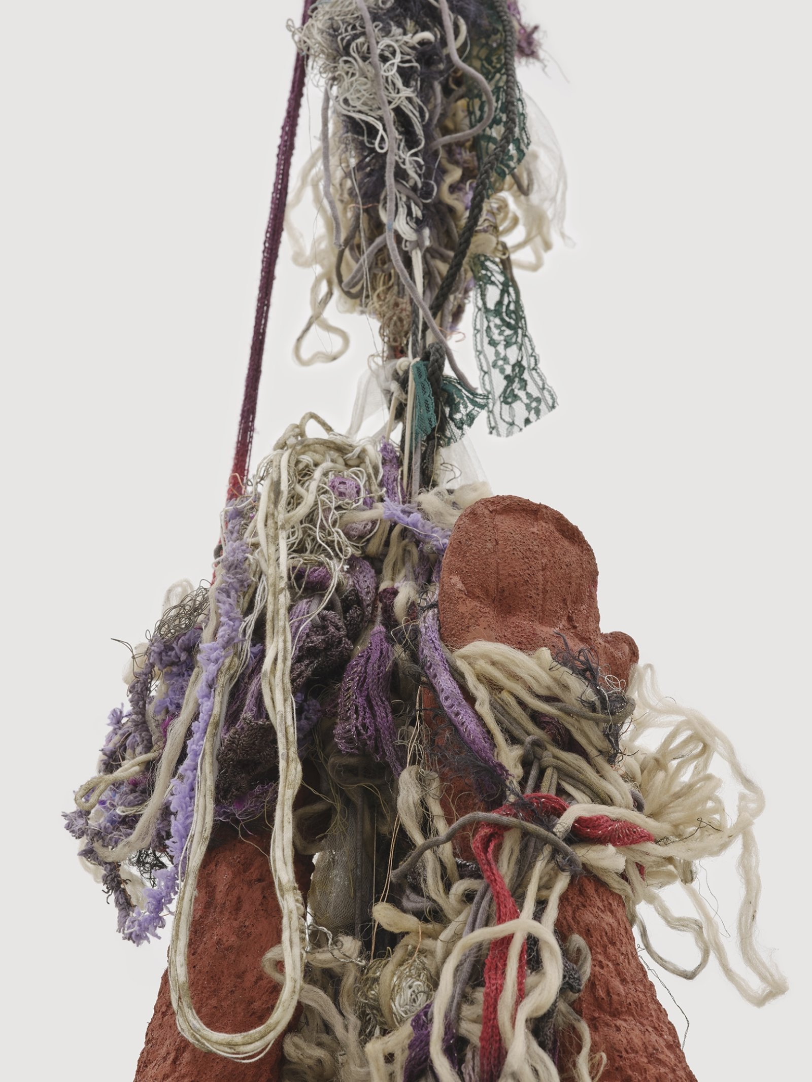 Liz Magor, Delivery (red) (detail), 2018, silicone rubber, textiles, twine, 144 x 24 x 13 in. (366 x 61 x 32 cm)