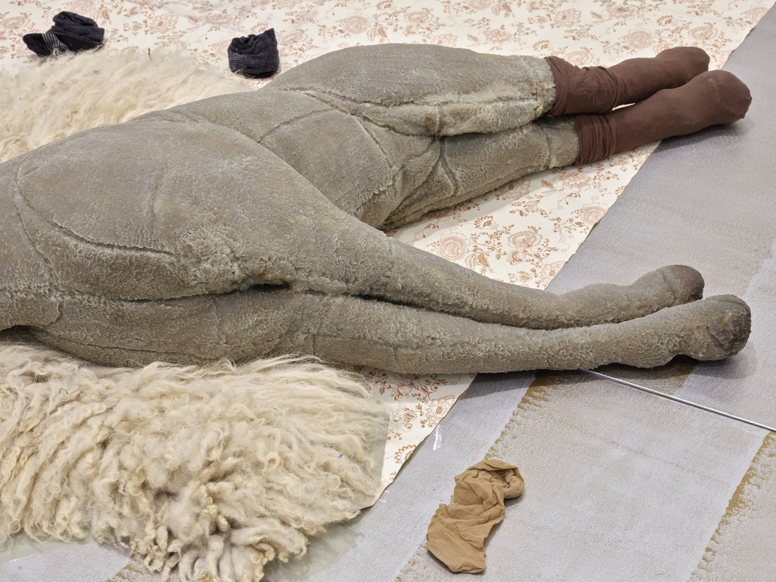 Liz Magor, Dressed (detail), 2020, painted plywood, fabric skirting, silicone rubber, hosiery, sheepskin, vinyl tablecloth, wood and ceramic crafts, plastic cup, dried lavender, packaging materials, 28 x 120 x 108 in. (71 x 305 x 274 cm)