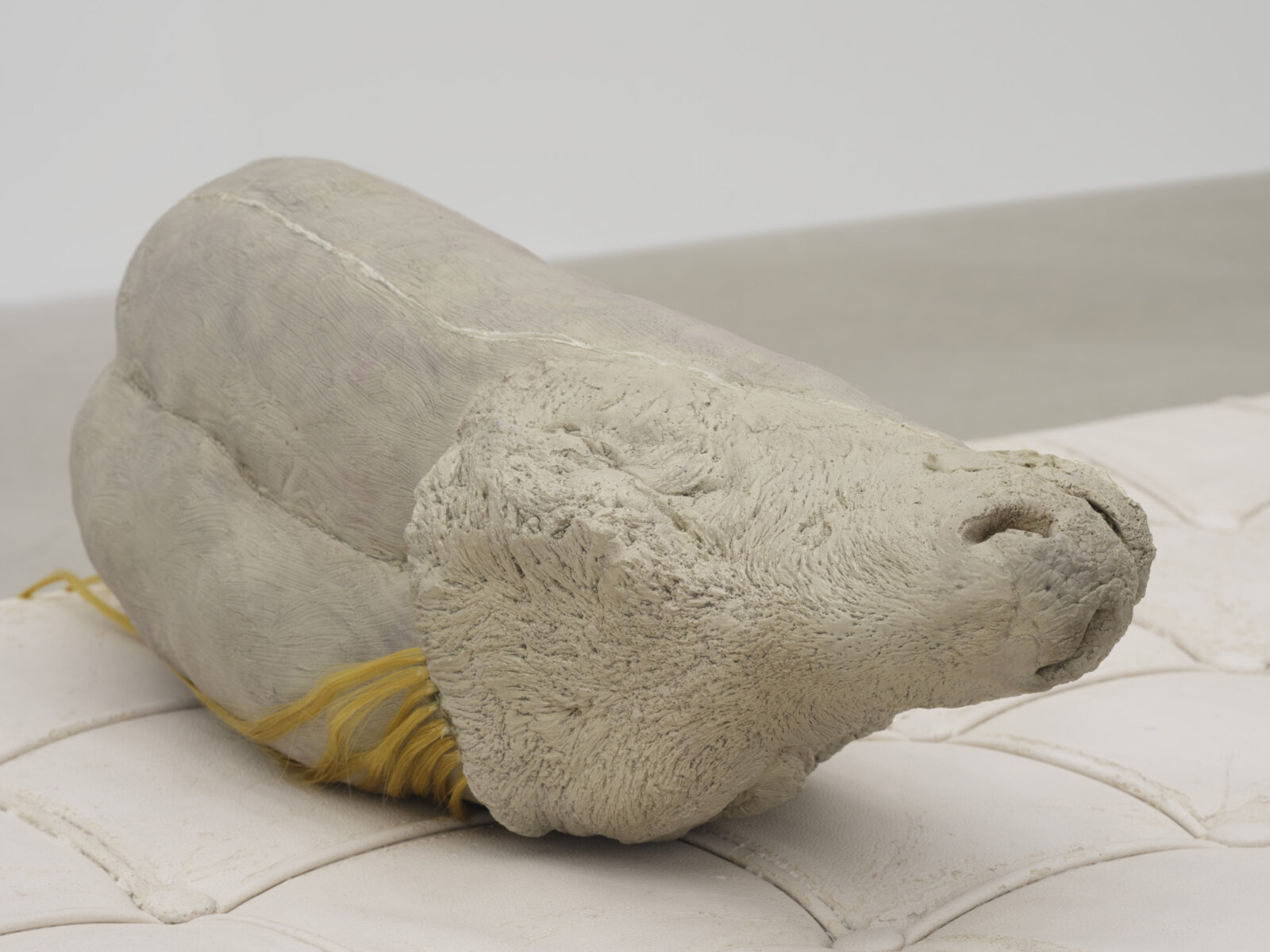 Liz Magor, Extension (detail), 2025, polymerized gypsum, synthetic hair, wood, 20 x 70 x 23 in. (51 x 178 x 58 cm)