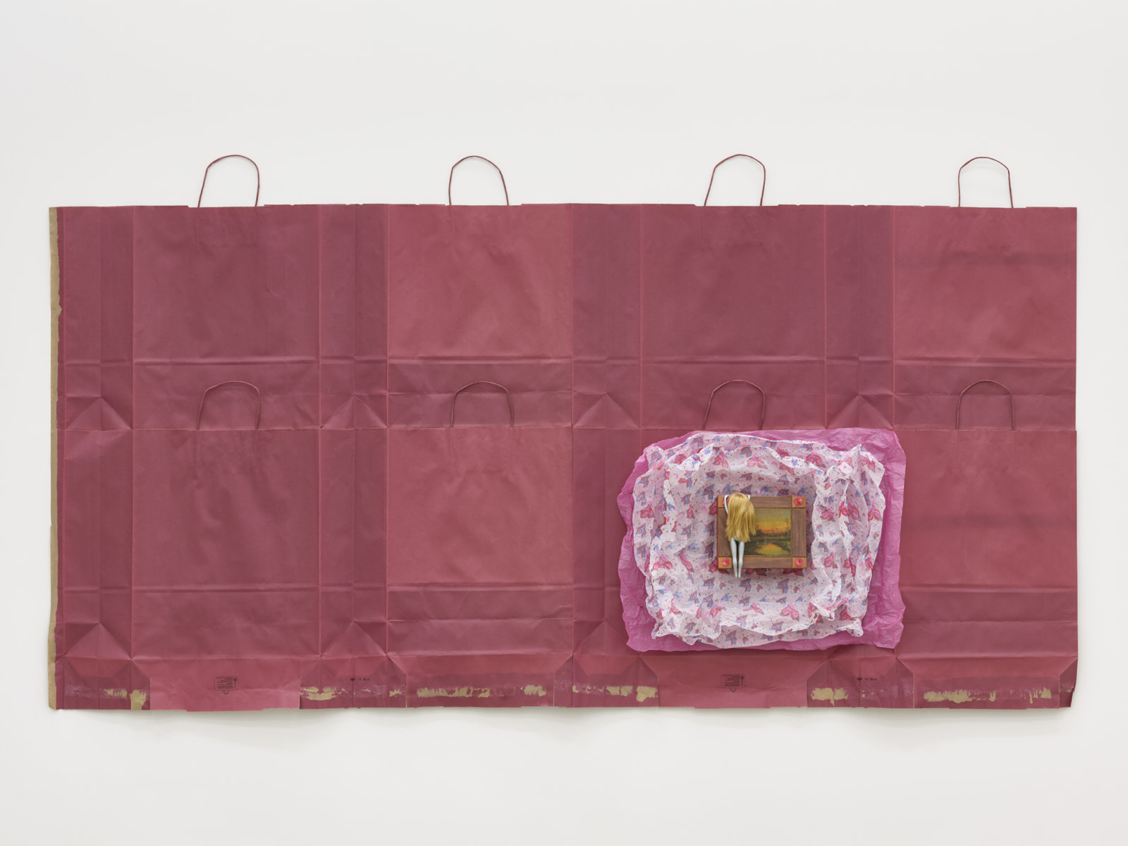 Liz Magor, Gateway, 2020, painted doll, wooden box, packaging materials, 43 x 88 x 3 in. (109 x 222 x 8 cm)