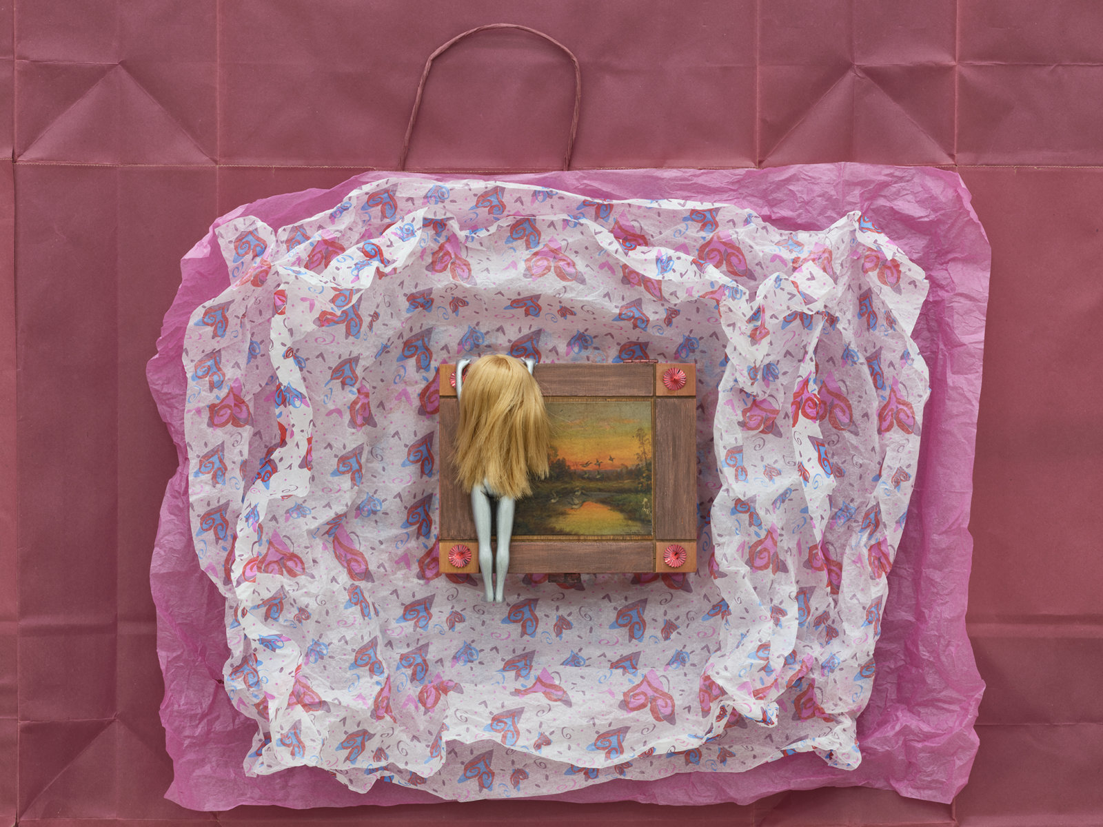 Liz Magor, Gateway (detail), 2020, painted doll, wooden box, packaging materials, 43 x 88 x 3 in. (109 x 222 x 8 cm)