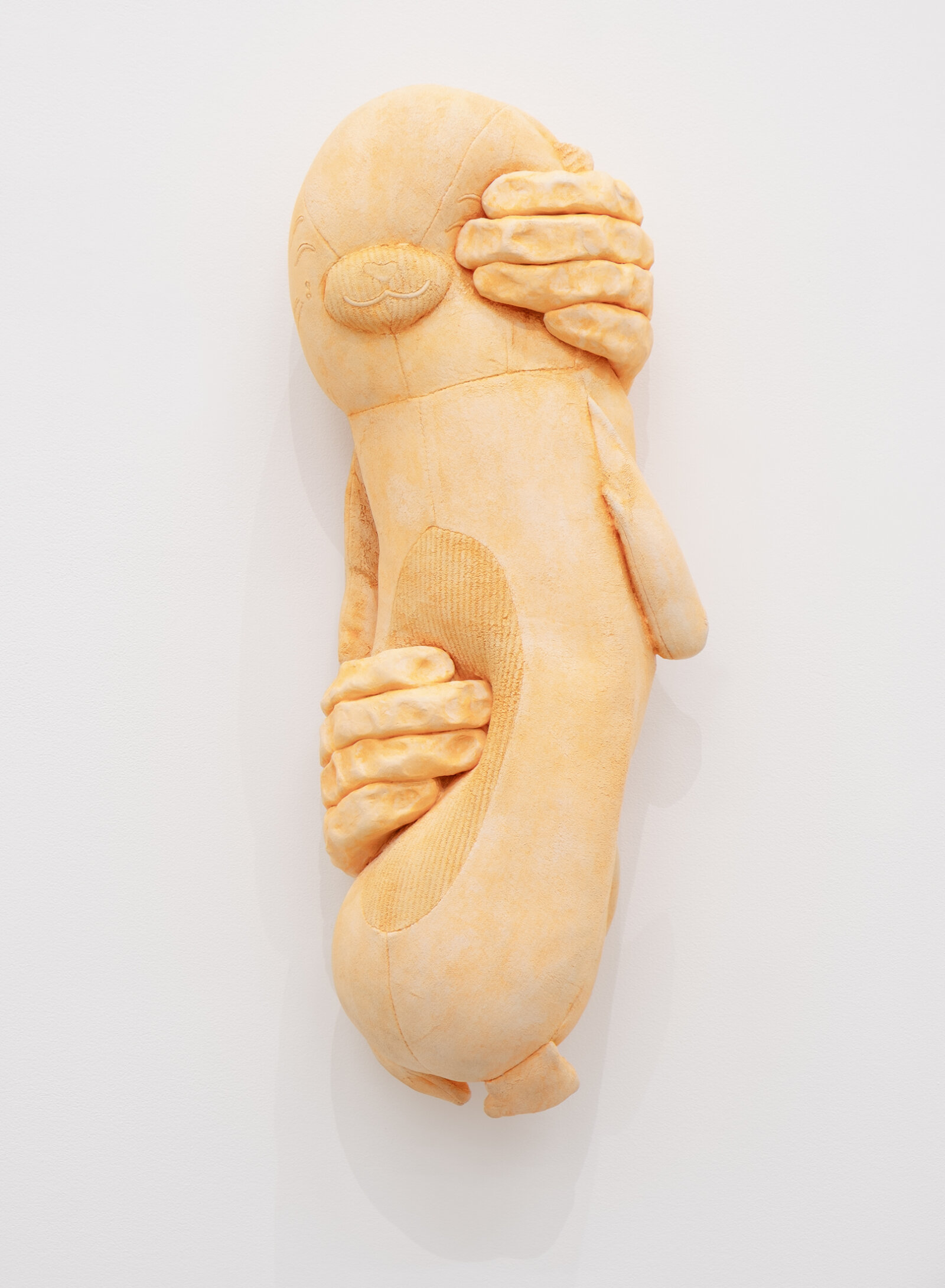 Liz Magor, PUNCH (fluorescent orange), 2026, polymerized gypsum, 22 x 9 x 6 in. (55 x 22 x 15 cm)