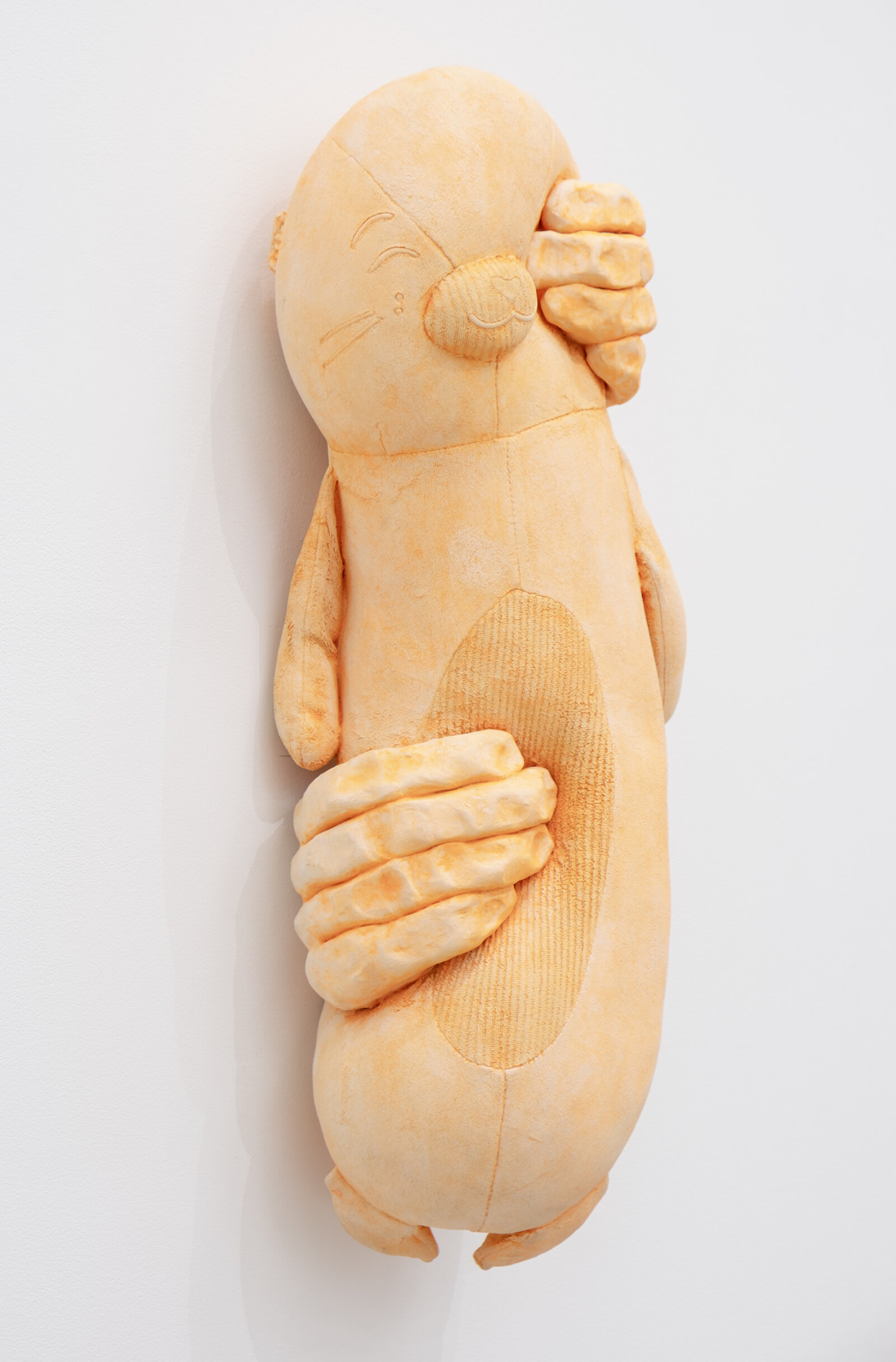 Liz Magor, PUNCH (fluorescent orange), 2026, polymerized gypsum, 22 x 9 x 6 in. (55 x 22 x 15 cm)