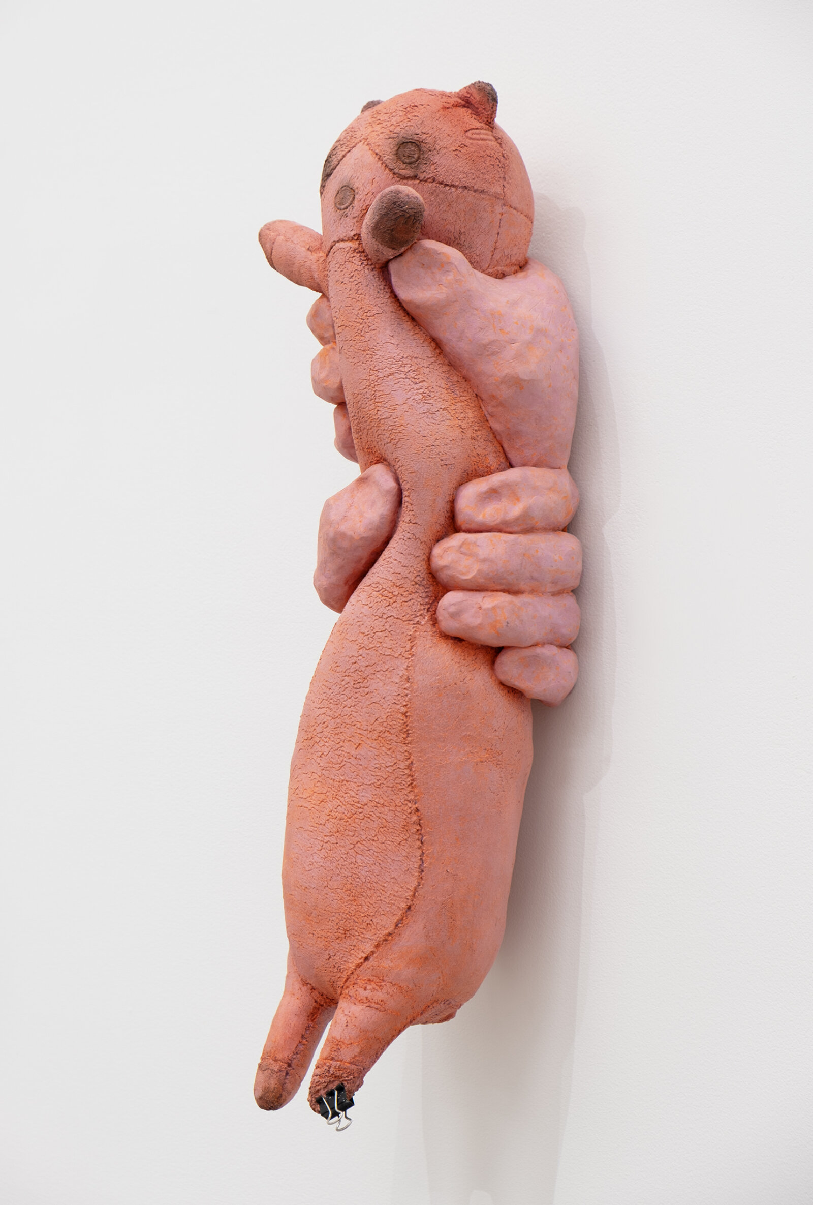 Liz Magor, PUNCH (quinacridone magenta), 2026, polymerized gypsum, metal clip, 19 x 6 x 5 in. (49 x 15 x 14 cm)