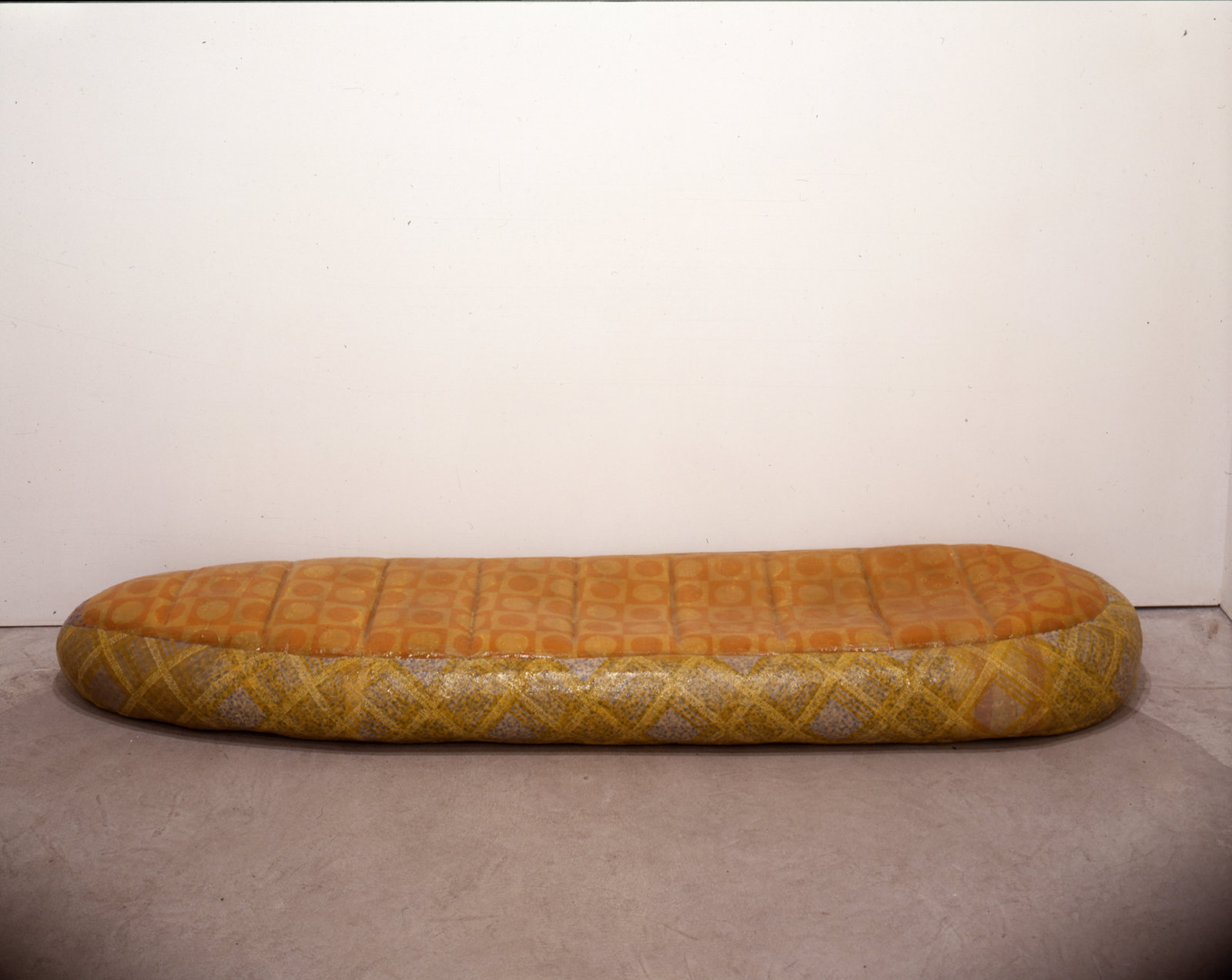 Liz Magor, Sleeping Bag 1, 1998, polyurethane rubber, fabric, 8 x 85 x 25 in. (20 x 216 x 62 cm). Photo: Isaac Applebaum