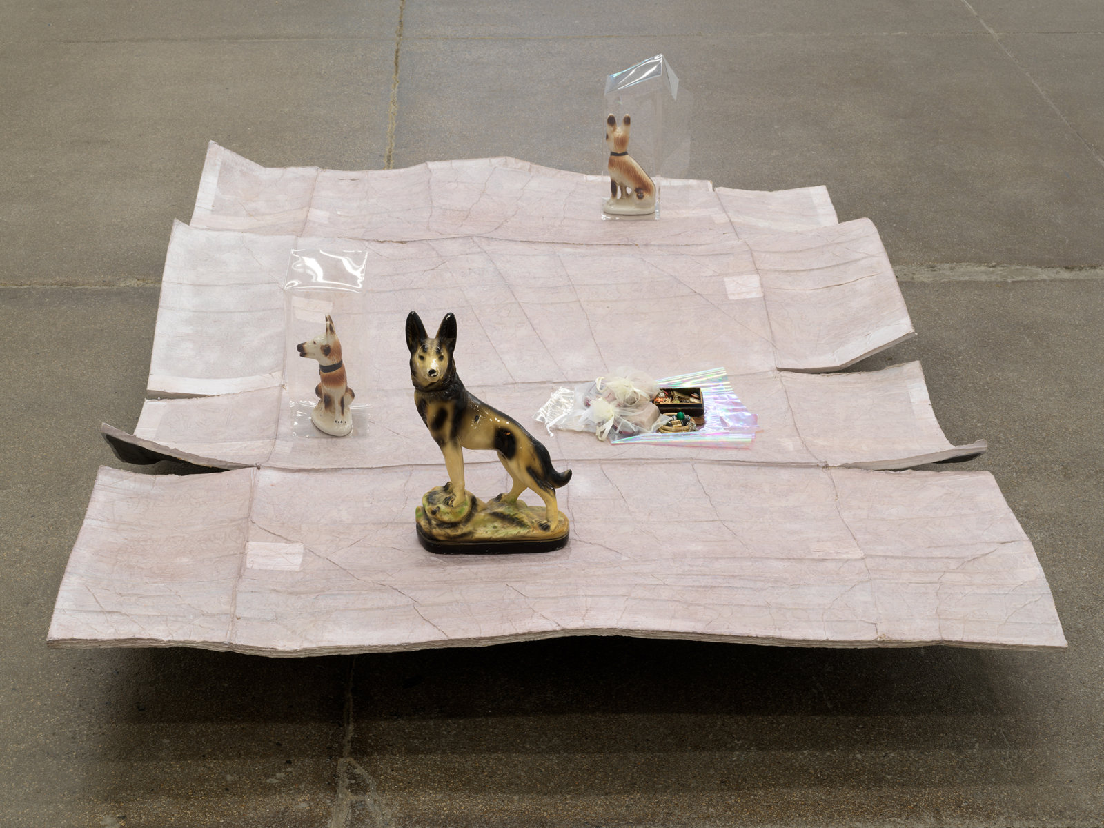 Liz Magor, Valley, 2017, ceramic, acrylic sheet, miscellaneous objects, polymerized gypsum, 21 x 78 x 56 in. (55 x 198 x 143 cm). Courtesy Andrew Kreps Gallery, New York