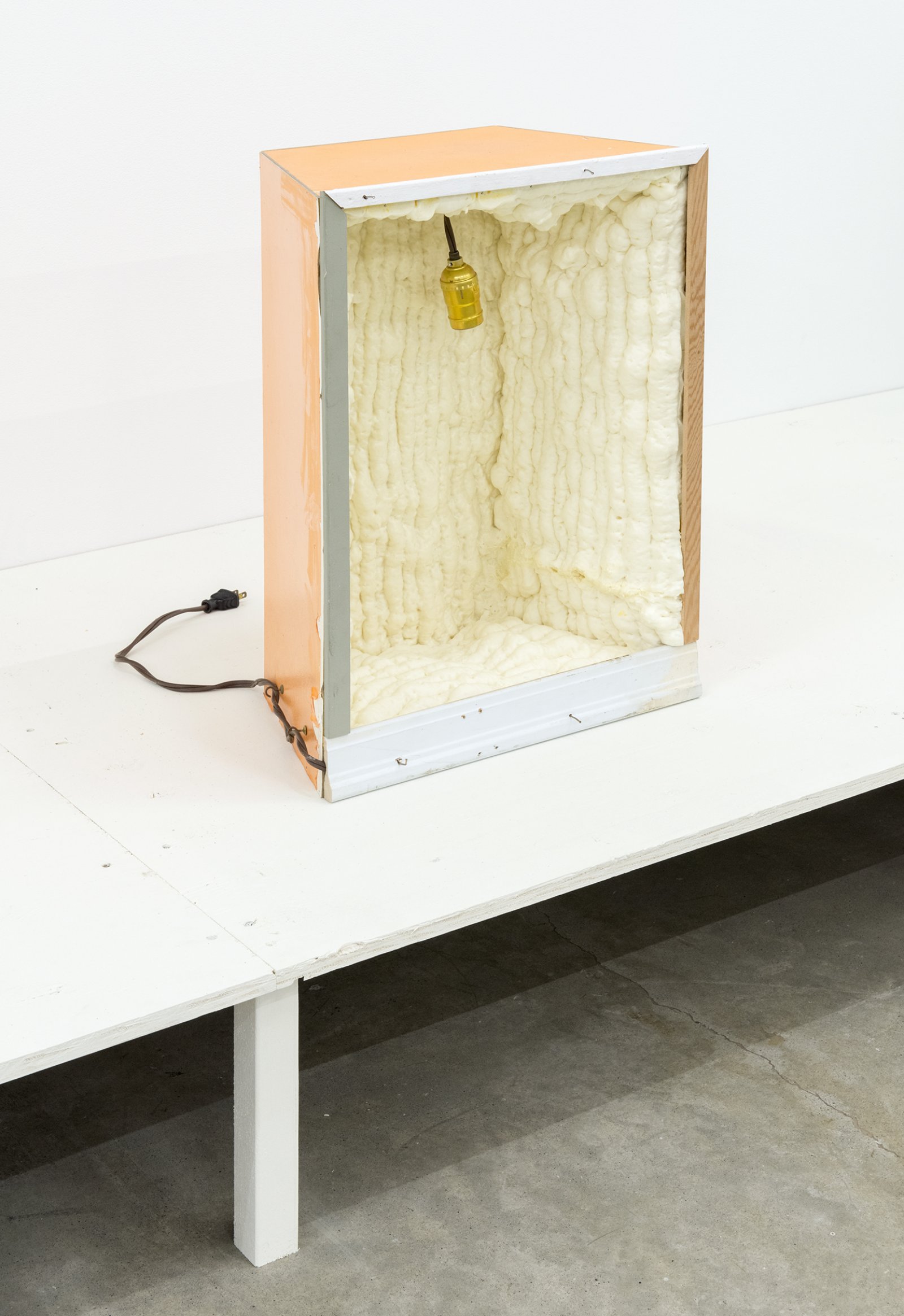 Gareth Moore, W-05e, 2013, expanding installation foam, pressboard, wood trim, nails, paint, light socket with plug, 21 x 16 x 10 in. (53 x 41 x 24 cm) by Ashes Withyman