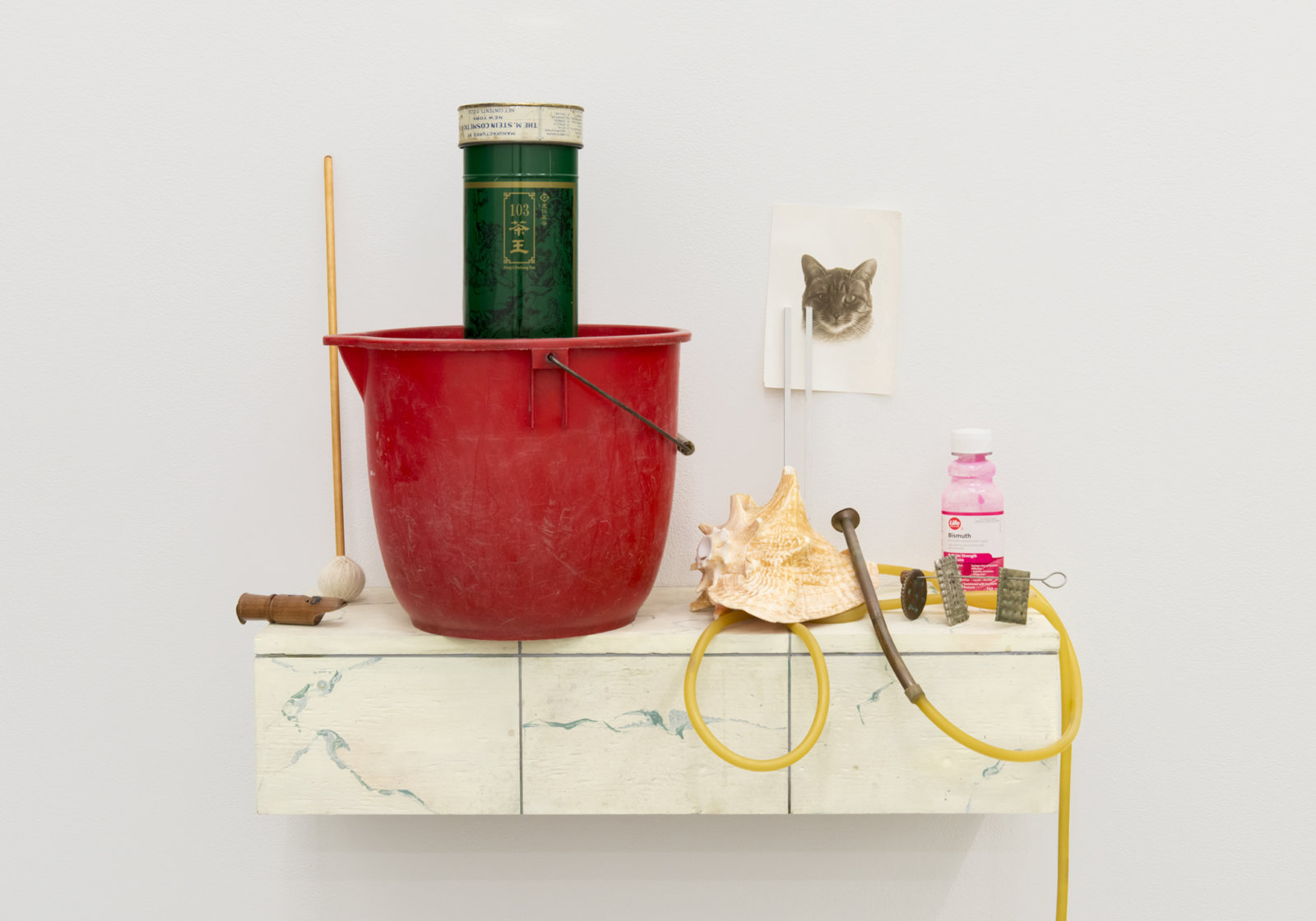 Ashes Withyman, Cetus, River, Furnas, Musca, Compass, Altar, Cup, 2017–2018, plastic bucket, tin, animal call parts, mallet, wood, medical tubing, conch, therapeutic tuning fork, cast: copper, brass and silver crackers, bismuth, wood, brass, bird whistle, found photograph, painted plywood, 44 x 28 x 13 in. (112 x 71 x 33 cm)
