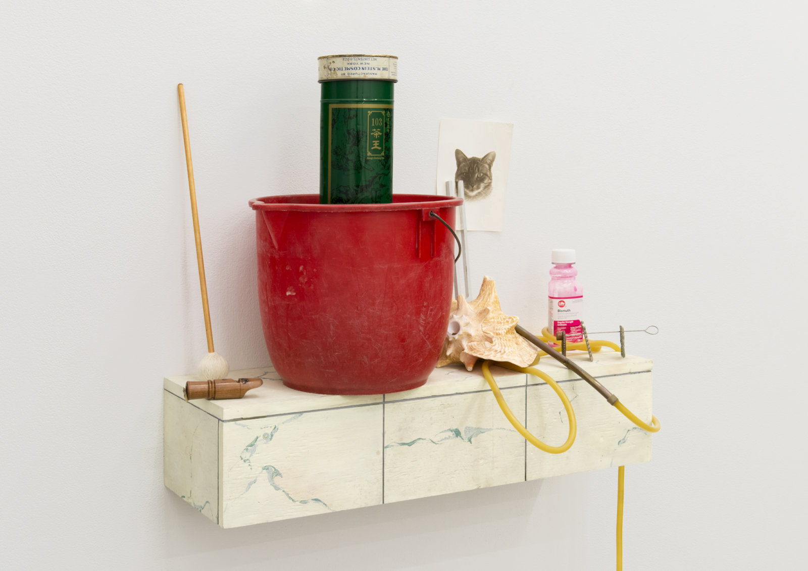 Ashes Withyman, Cetus, River, Furnas, Musca, Compass, Altar, Cup, 2017–2018, plastic bucket, tin, animal call parts, mallet, wood, medical tubing, conch, therapeutic tuning fork, cast: copper, brass &amp; silver crackers, bismuth, wood, brass, bird whistle, found photograph, painted plywood, 44 x 28 x 13 in. (112 x 71 x 33 cm)