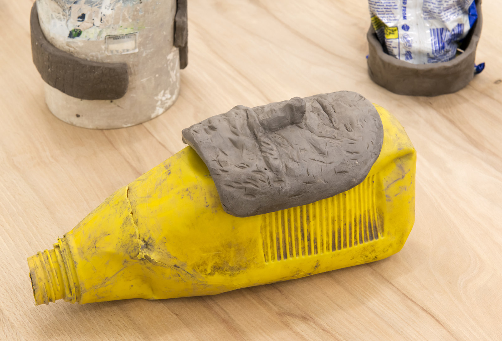 Ashes Withyman, Funeral Vessels (detail), 2014, found objects and unfired clay dredged from the Forth and Clyde canal, Glasgow, 40 x 96 x 23 in. (100 x 243 x 58 cm)