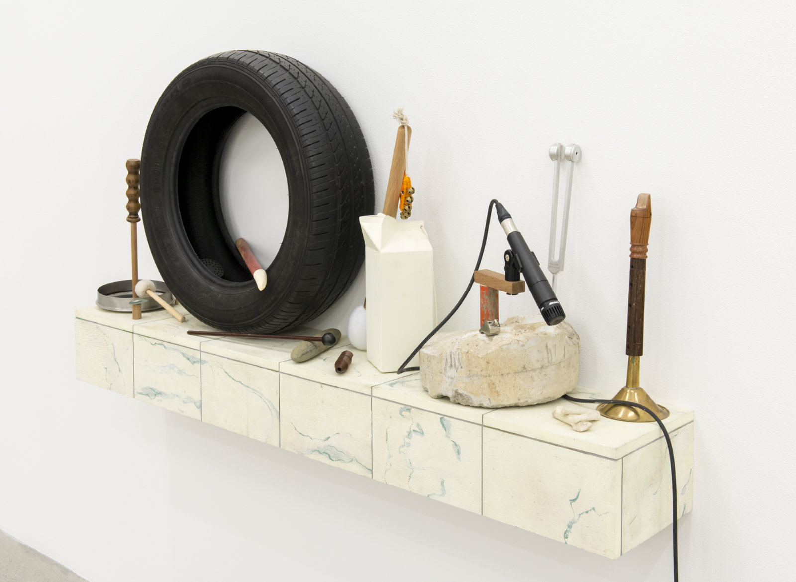 Ashes Withyman, Furnas, Altar, River, Musca, Compass, Cetus, Cup, 2017–2018, wood, tire, pot top, deer call, whale tooth, river stone, painted steel, microphone, concrete, bones, therapeutic tuning fork, stag call, whistles, homemade fox call, bells, musical instrument parts, painted plywood, 45 x 54 x 9 in. (114 x 137 x 23 cm)