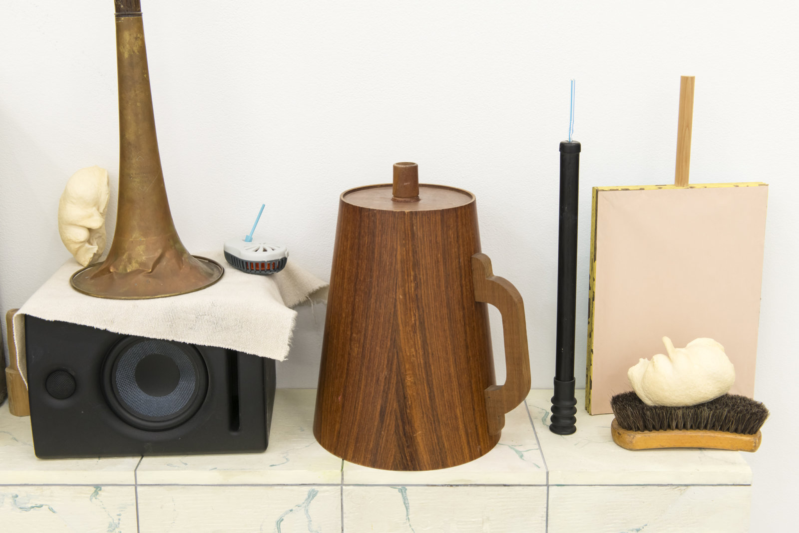 Ashes Withyman, Furnas, Compass, Altar, Musca, River, Cetus, Cup (detail), 2017–2018, tool box, styrofoam cup, mallet, brass horn, bullae, mosquito repelling devices, shoe brush, paper, wood, brass, animal call parts, musical instrument parts, pump, speaker, painted plywood, 34 x 63 x 14 in. (86 x 160 x 34 cm)