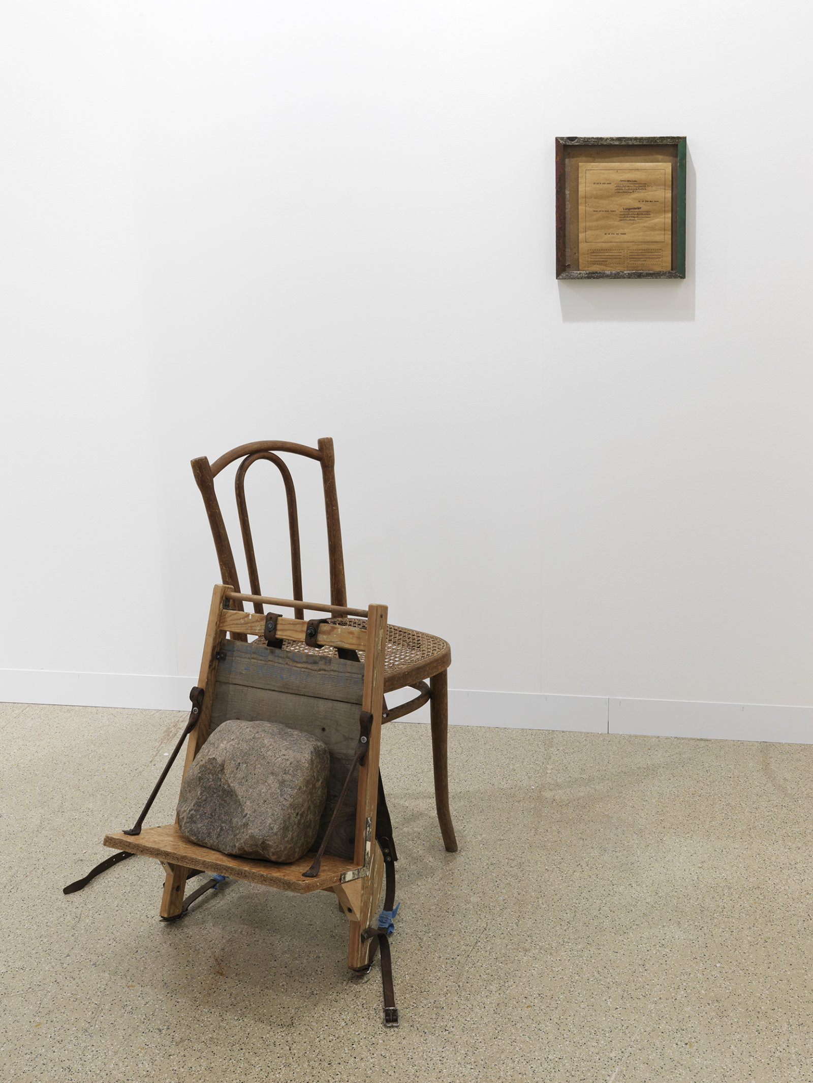 Ashes Withyman, If it’s not here, it’s over there, on its way there or on its way back here, 2010, leather, wood, rock, ink, paper, bolts, screws, chair, dimensions variable