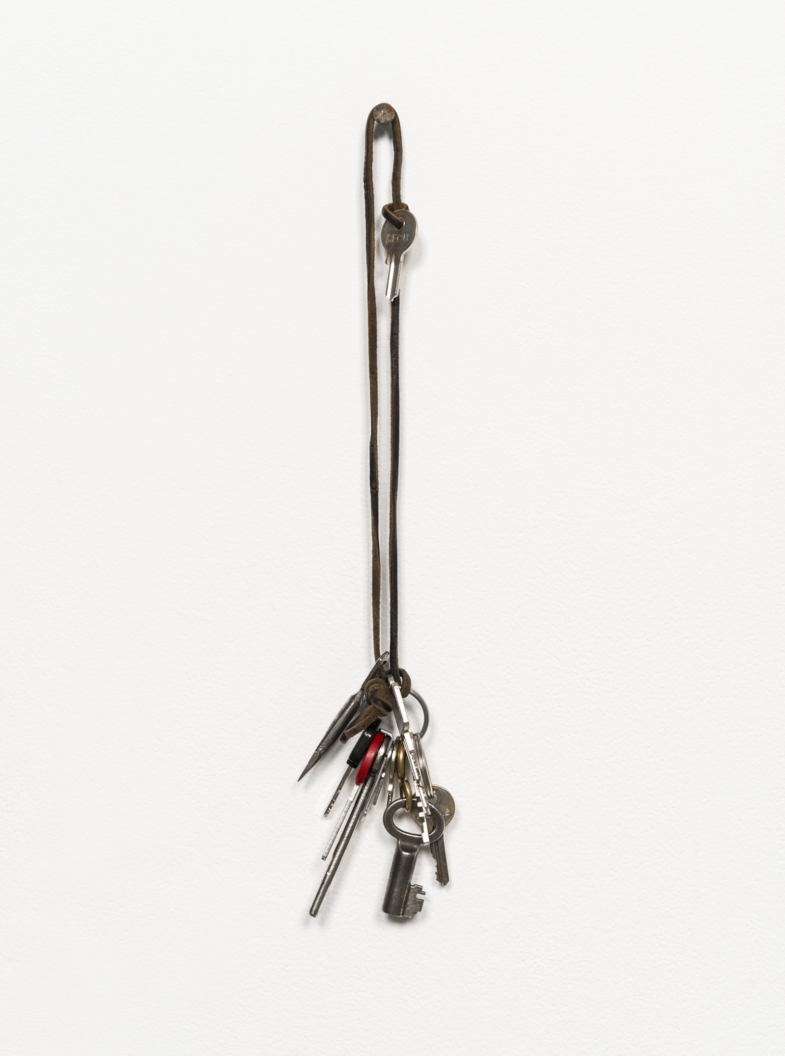 Ashes Withyman, Keys from a place, near the buried canal, 2011–2012, keys, leather, 15 x 3 x 2 in. (37 x 8 x 5 cm)