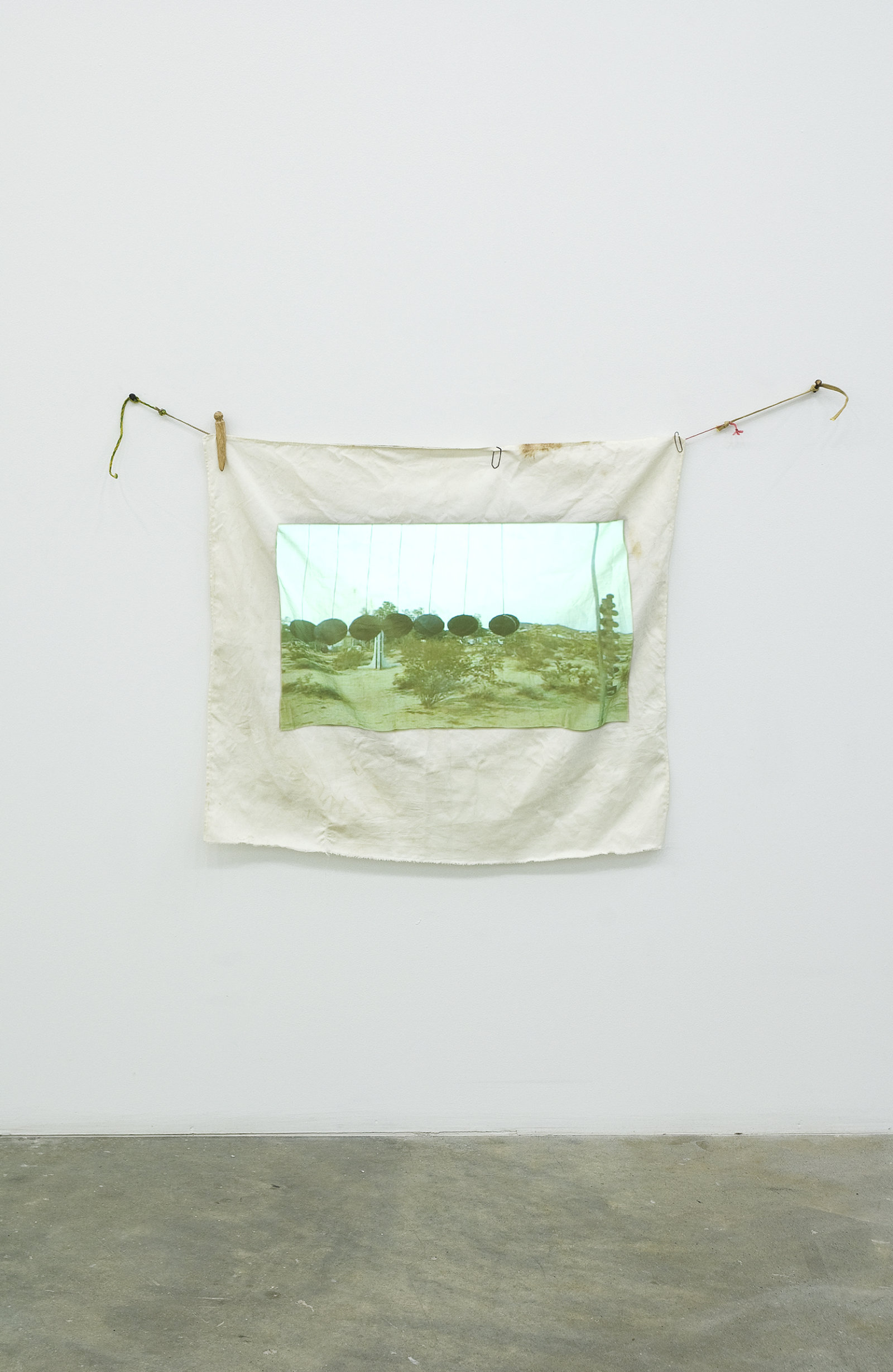 Ashes Withyman, Travel Without Movement from Uncertain Pilgrimage, 2006–2007, dvd projection, cloth projection screen, clothespins, paperclips, string, 32 x 41 in. (80 x 105 cm), 12 minutes, 10 seconds