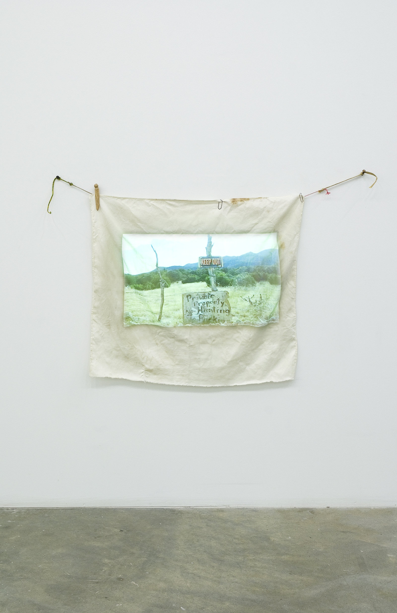 Ashes Withyman, Travel Without Movement from Uncertain Pilgrimage, 2006–2007, dvd projection, cloth projection screen, clothespins, paperclips, string, 32 x 41 in. (80 x 105 cm), 12 minutes, 10 seconds