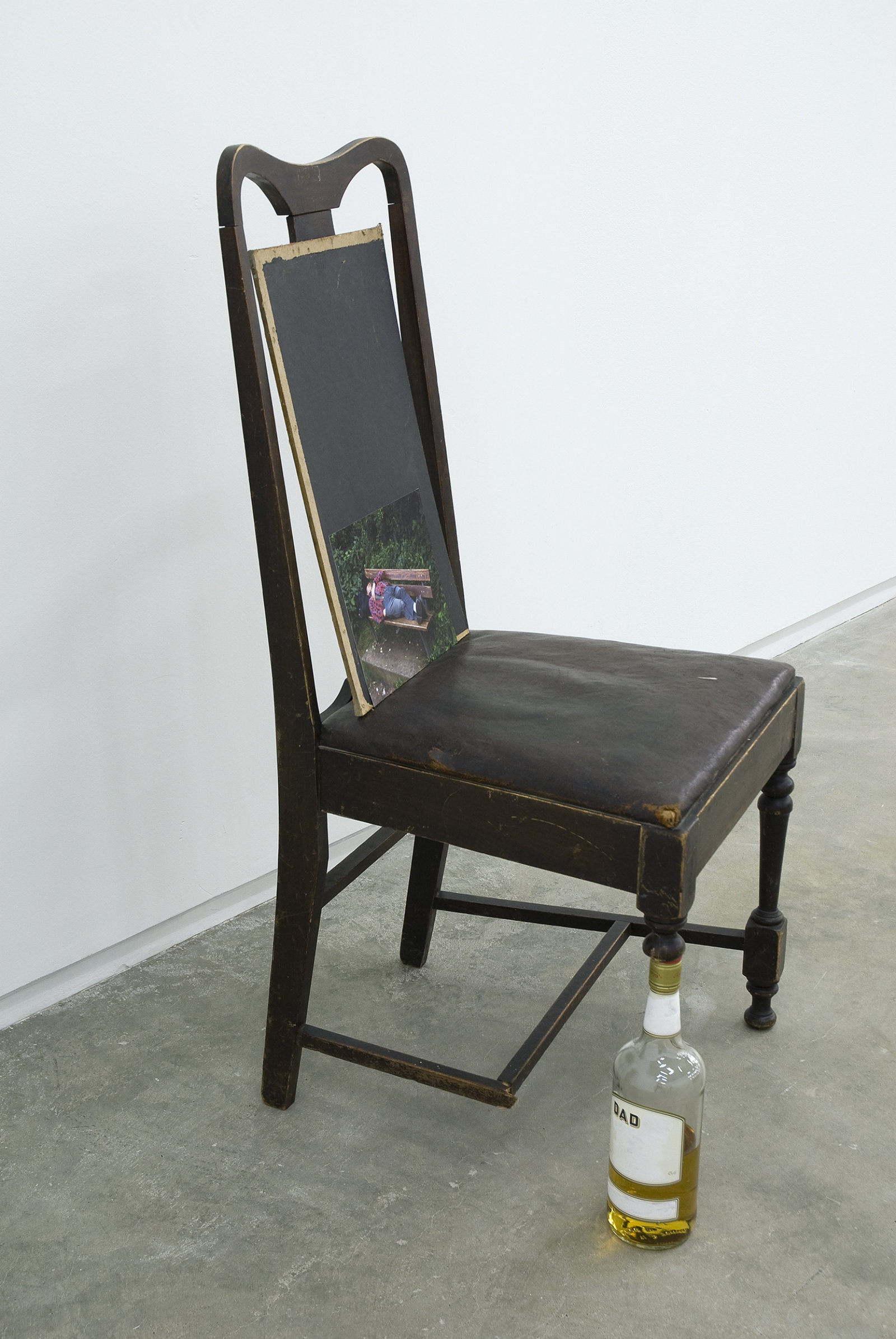Gareth Moore, Untitled from Uncertain Pilgrimage, 2009, broken chair, whiskey, paint, wood, ‘Friend in Theatre, Asleep’ lightjet print, 40 x 19 x 18 in. (102 x 47 x 44 cm)