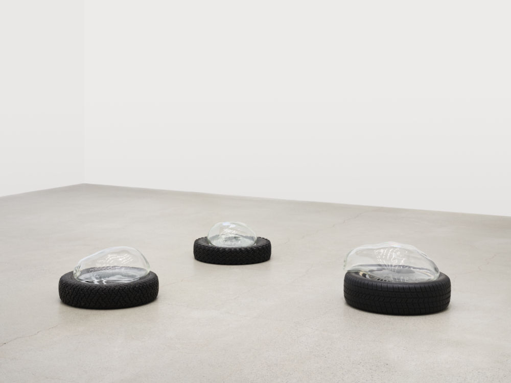 Jerry Pethick, Aerial View, 2001–2002, tires, spectrafoil cut-outs, black silicone, blown glass, dimensions variable by 