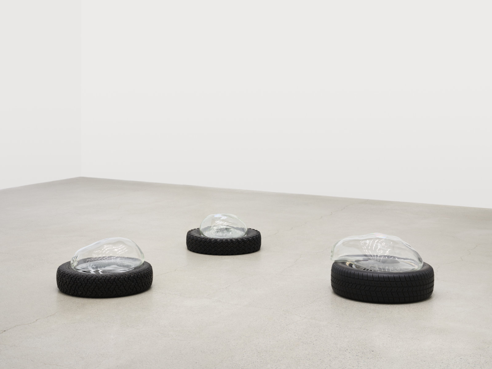 Jerry Pethick, Aerial View, 2001–2002, tires, spectrafoil cut-outs, black silicone, blown glass, dimensions variable
