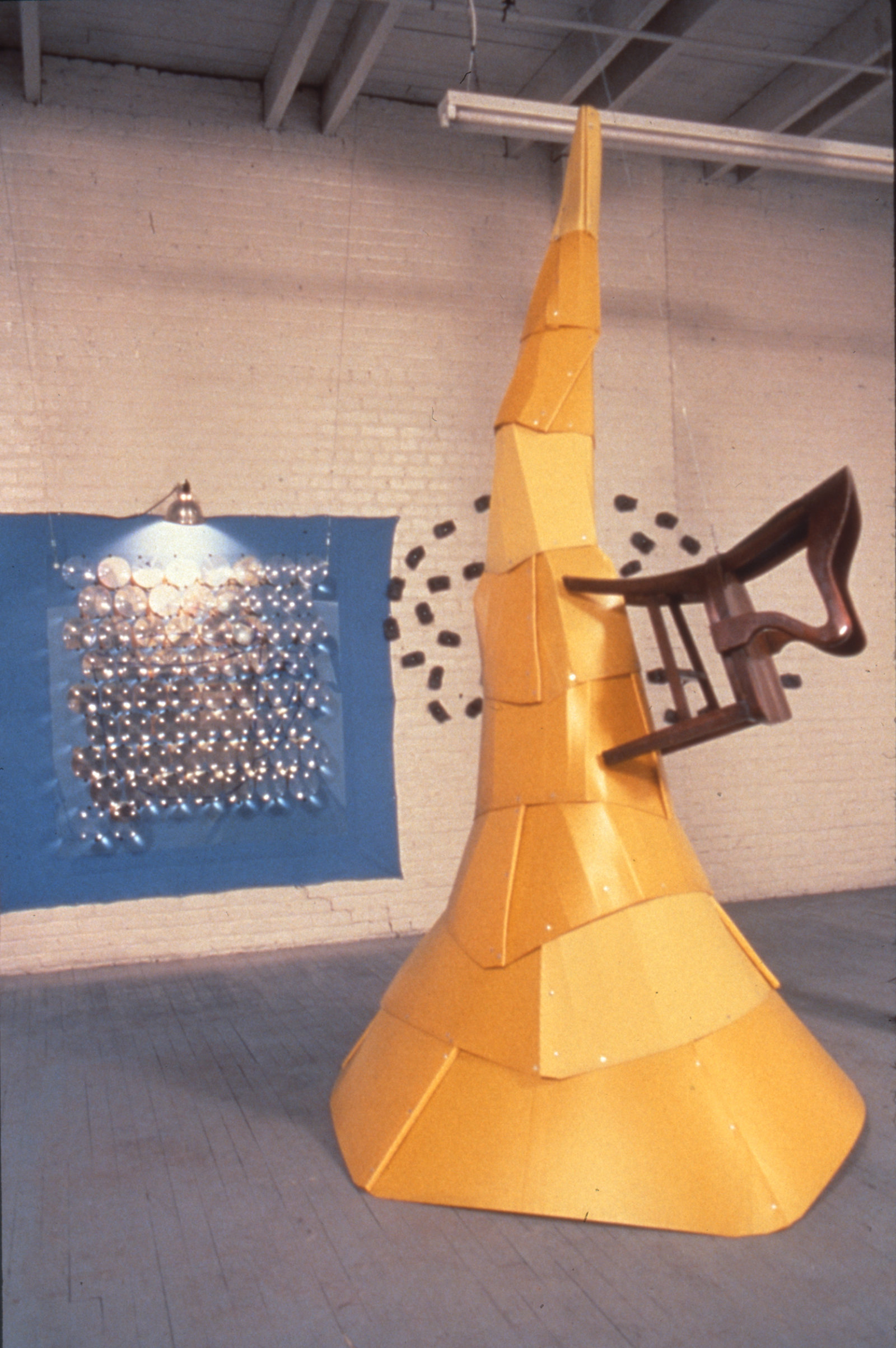 Jerry Pethick, Draw Bridge Dilemma, 1990, yellow foam core, steel wool, chair, glass, photo array, 51 x 73 x 57 in. (130 x 186 x 144 cm)