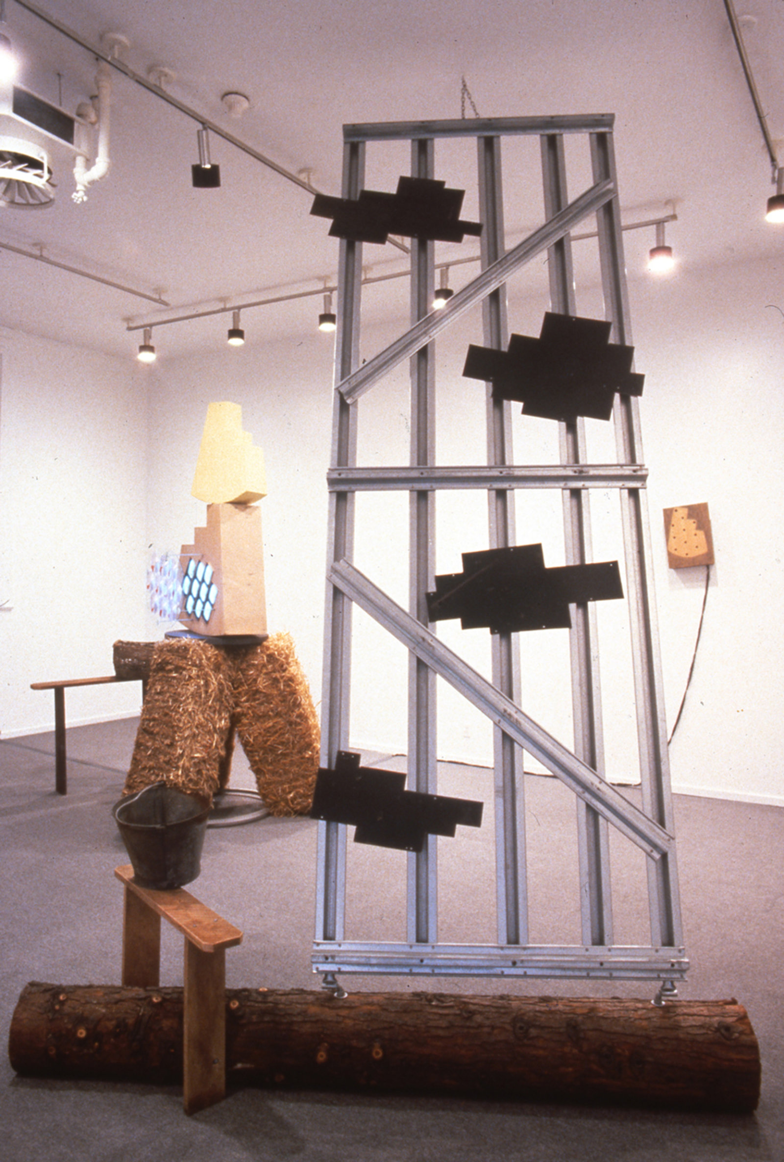 Jerry Pethick, Drawn on the Eye, 1991–1994, straw bales, gate, monitors, cameras, wood, enamelled steel, sulphur, lenses, pail, basket, transformers, 156 x 360 x 132 in. (396 x 914 x 335 cm)
