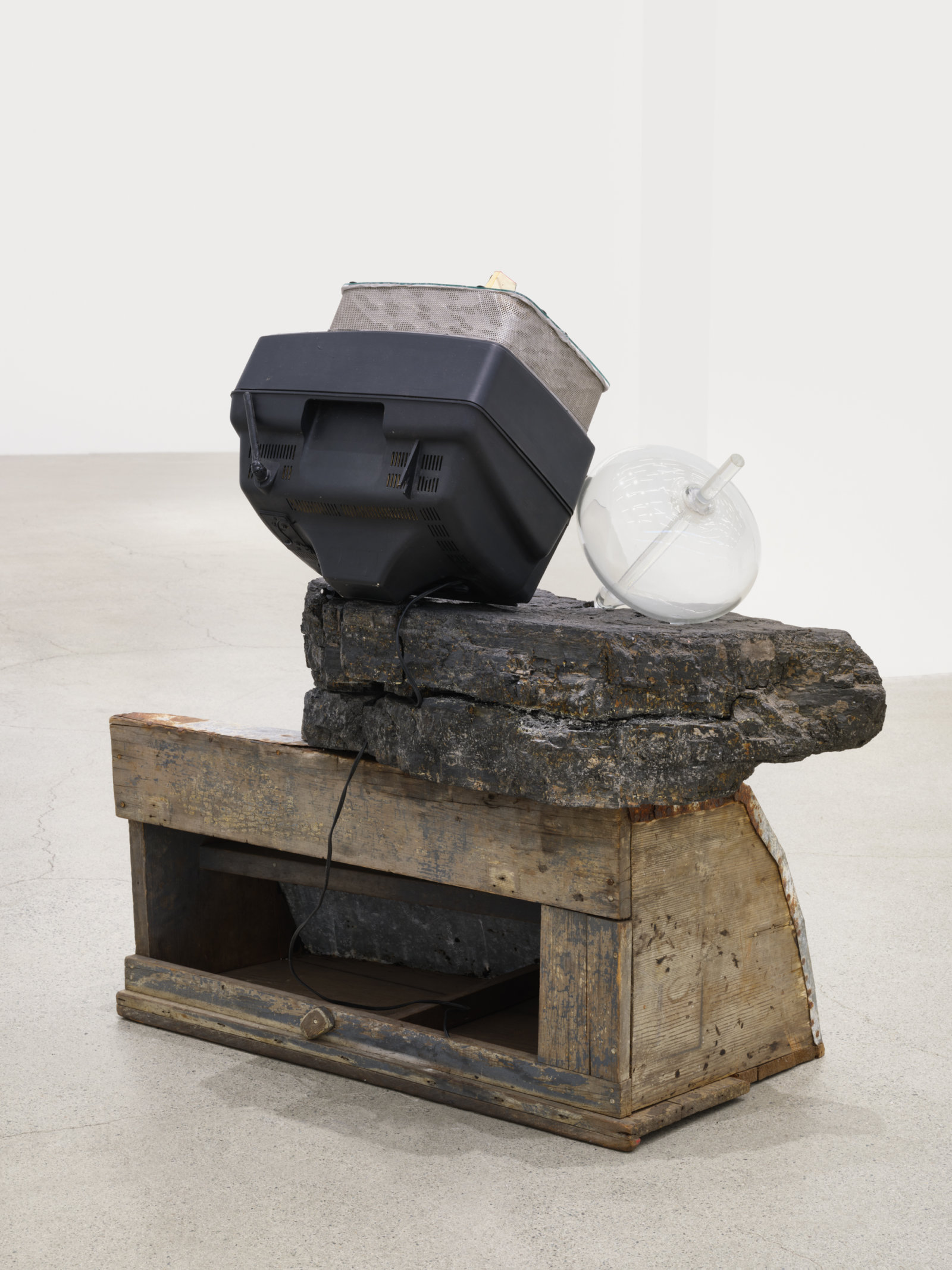 Jerry Pethick, Floating Free, 1972–93, wood, galvanized metal, plastic, coal, TV, duratrans, blown glass, lenses, aluminum, tiles, silicone, 42 3/4 x 26 1/2 x 41 1/2 in. (109 x 67 x 105 cm)