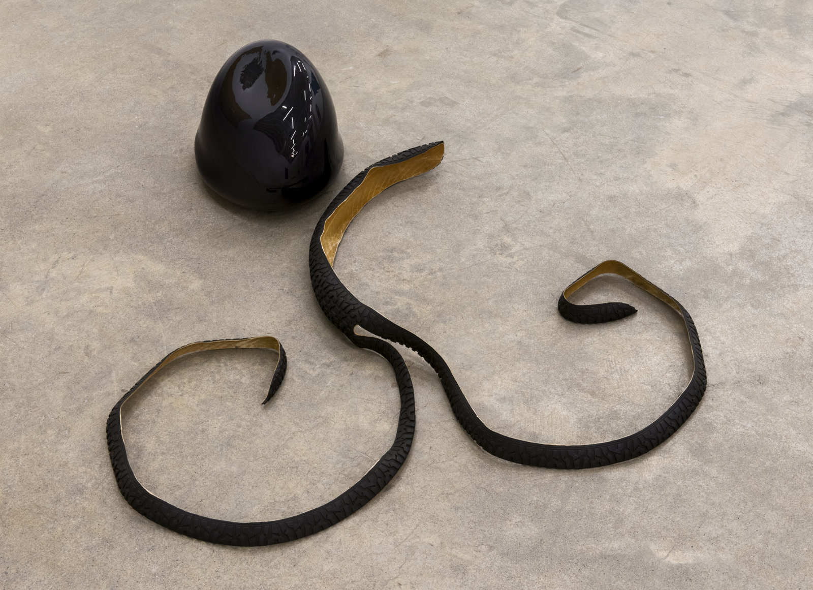 Jerry Pethick, Kolossus of Kindergarden (detail), 1987–1989, spectra-foil on records, aluminium, blown glass, wood, rock, tires, cargo blanket, dimensions variable
