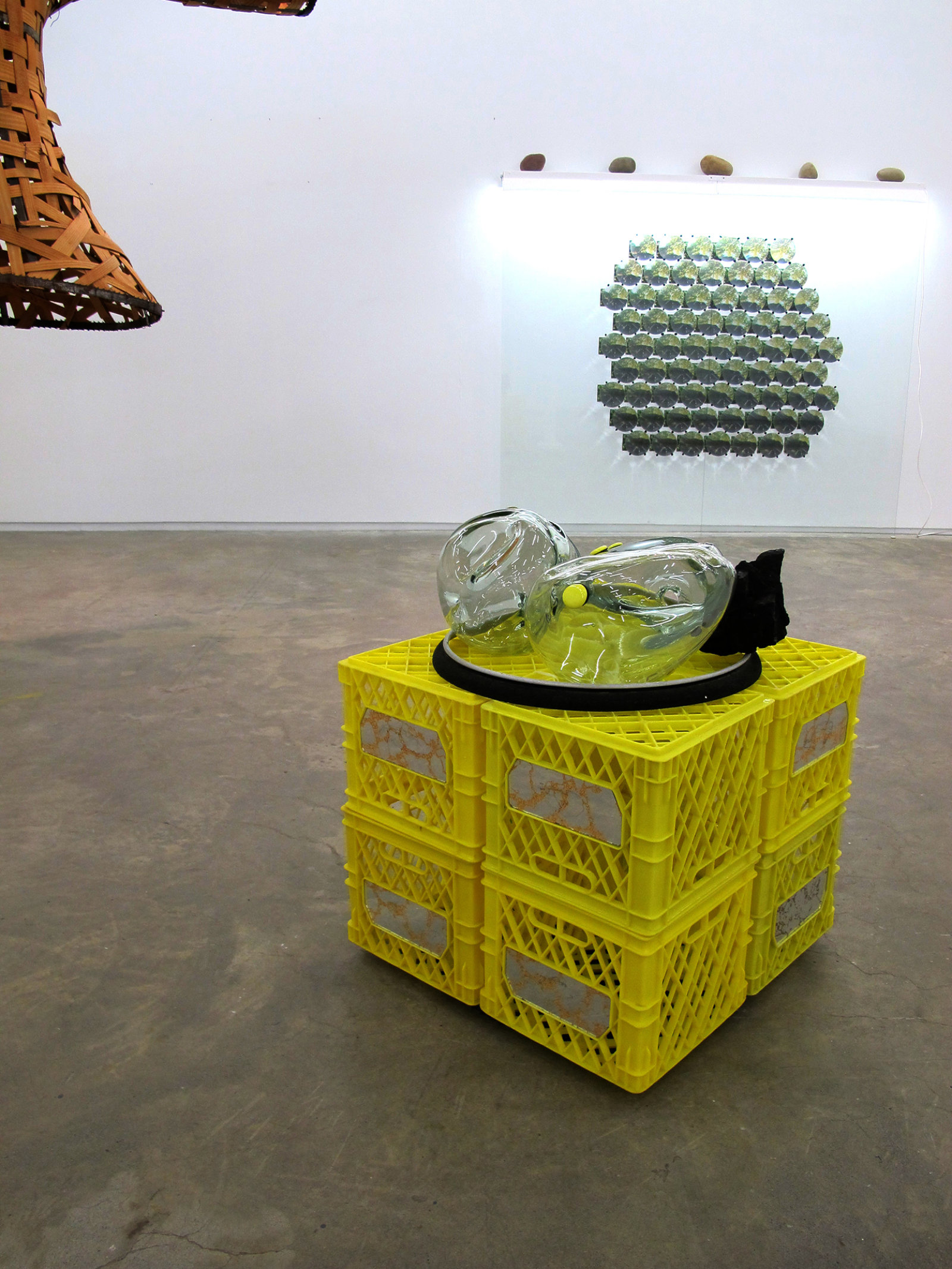 Jerry Pethick, Semaphore Goya (detail), 1991, woven wicker shirt, cable, milk crates, blown glass shapes, coal, aluminum ring, saw blades, glass, light fixtures, river rocks, photographs, fresnel lenses, mirrors, small yellow glass, 157 x 197 x 177 in. (399 x 500 x 450 cm)