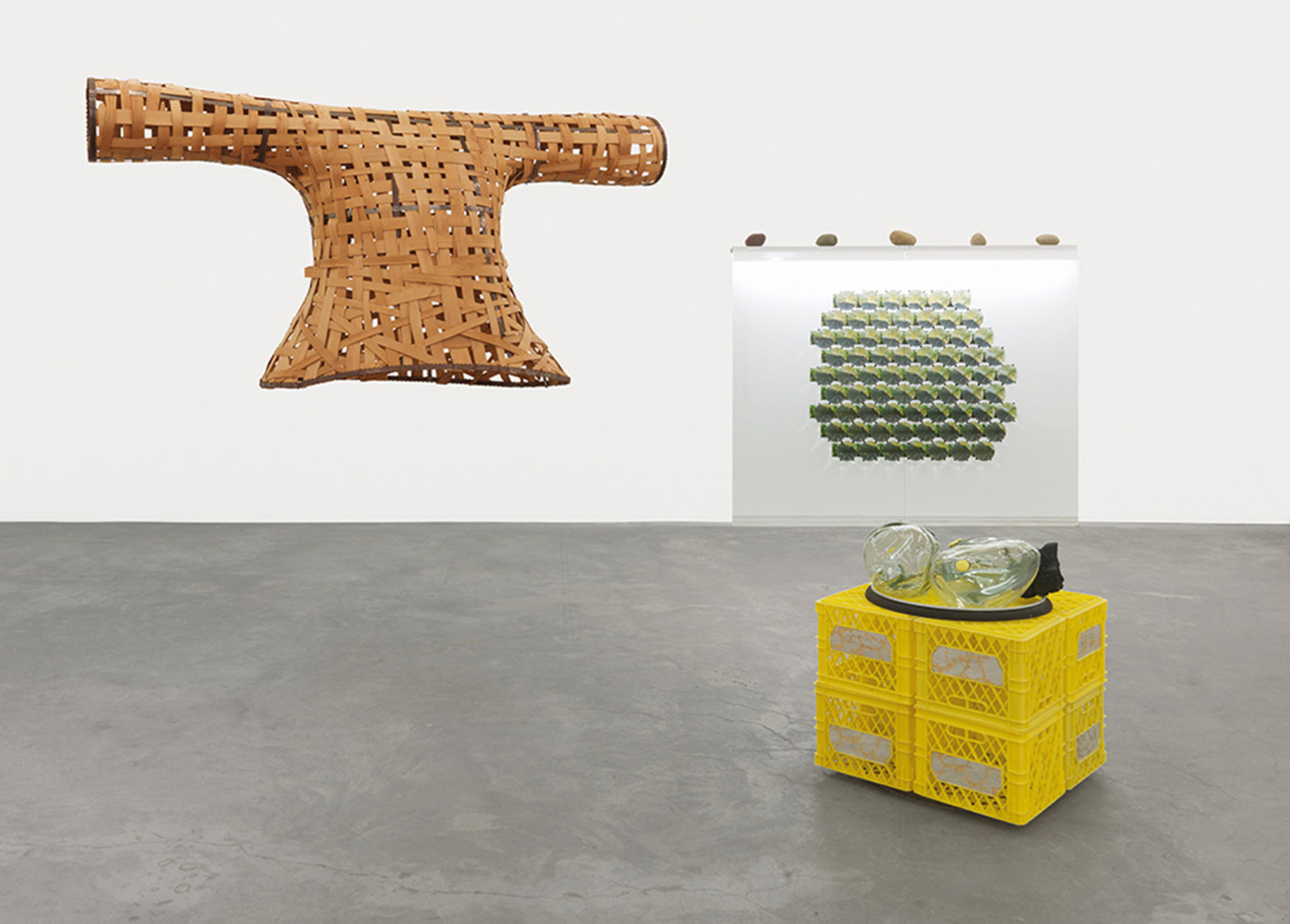 Jerry Pethick, Semaphore Goya, 1991, woven wicker shirt, cable, milk crates, blown glass shapes, coal, aluminum ring, saw blades, glass, light fixtures, river rocks, photographs, fresnel lenses, mirrors, small yellow glass, 157 x 197 x 177 in. (399 x 500 x 450 cm)