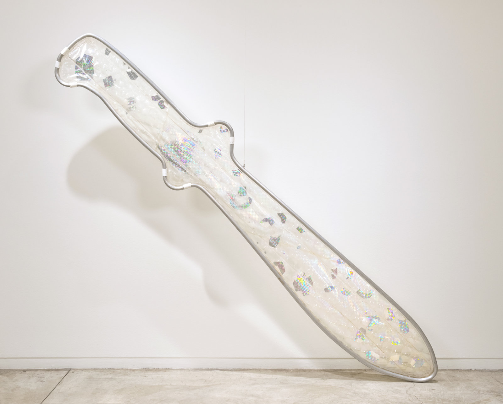 Jerry Pethick, Snow Knife Floating in Memory, 1978–1979, fresnel lens sheet, etched diffraction grating, aluminum, silicone, 120 x 21 x 2 in. (305 x 53 x 5 cm)