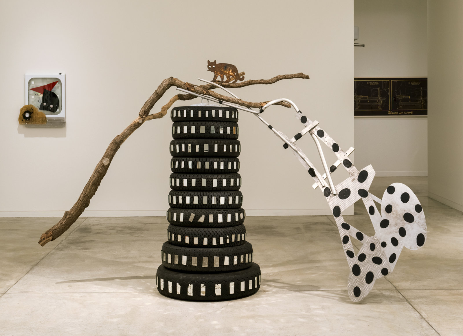 Jerry Pethick, Toy Tower/Whose Limbs are we out on?, 1985, rubber tires, aluminum, mirror, silicone, glass, wooden branch, 118 x 75 x 33 in. (300 x 190 x 84 cm)