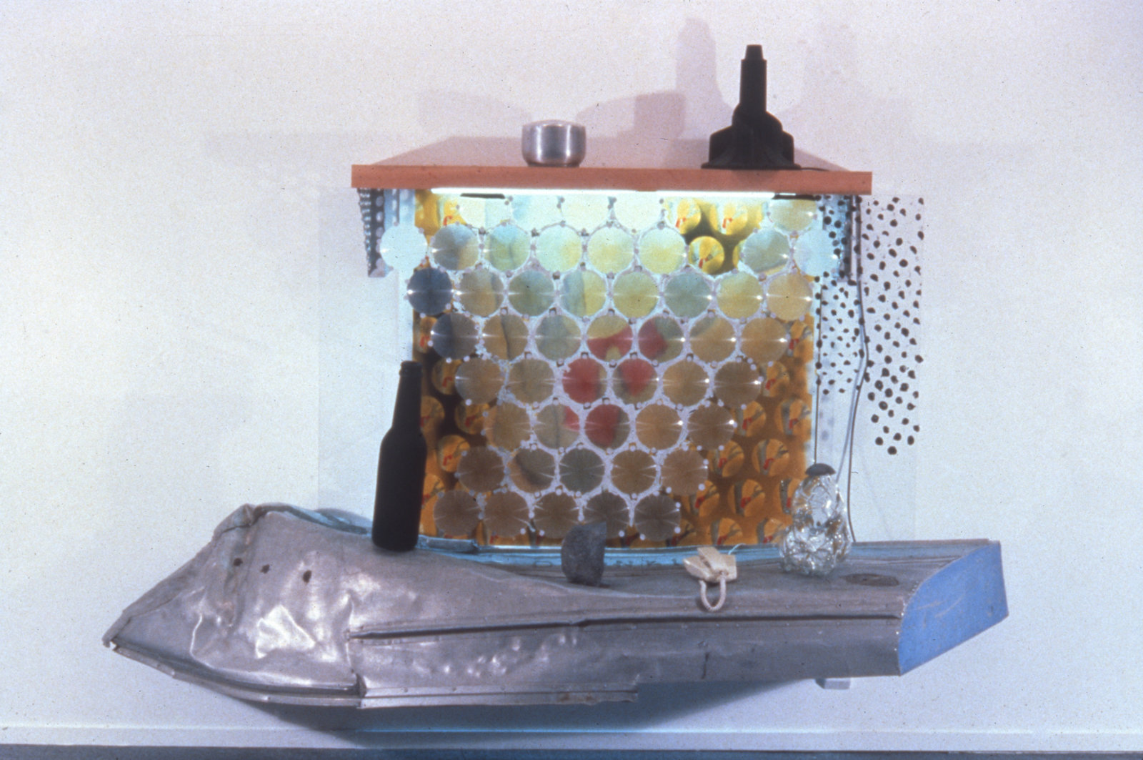 Jerry Pethick, Wreck of the D Jonkin, 1988–1994, photo array, aluminum, wood, silicone, bakelite, plastic, telephone, recorder, sound, light, fixture, glass, stone, 11 x 9 x 3 in. (28 x 23 x 8 cm)