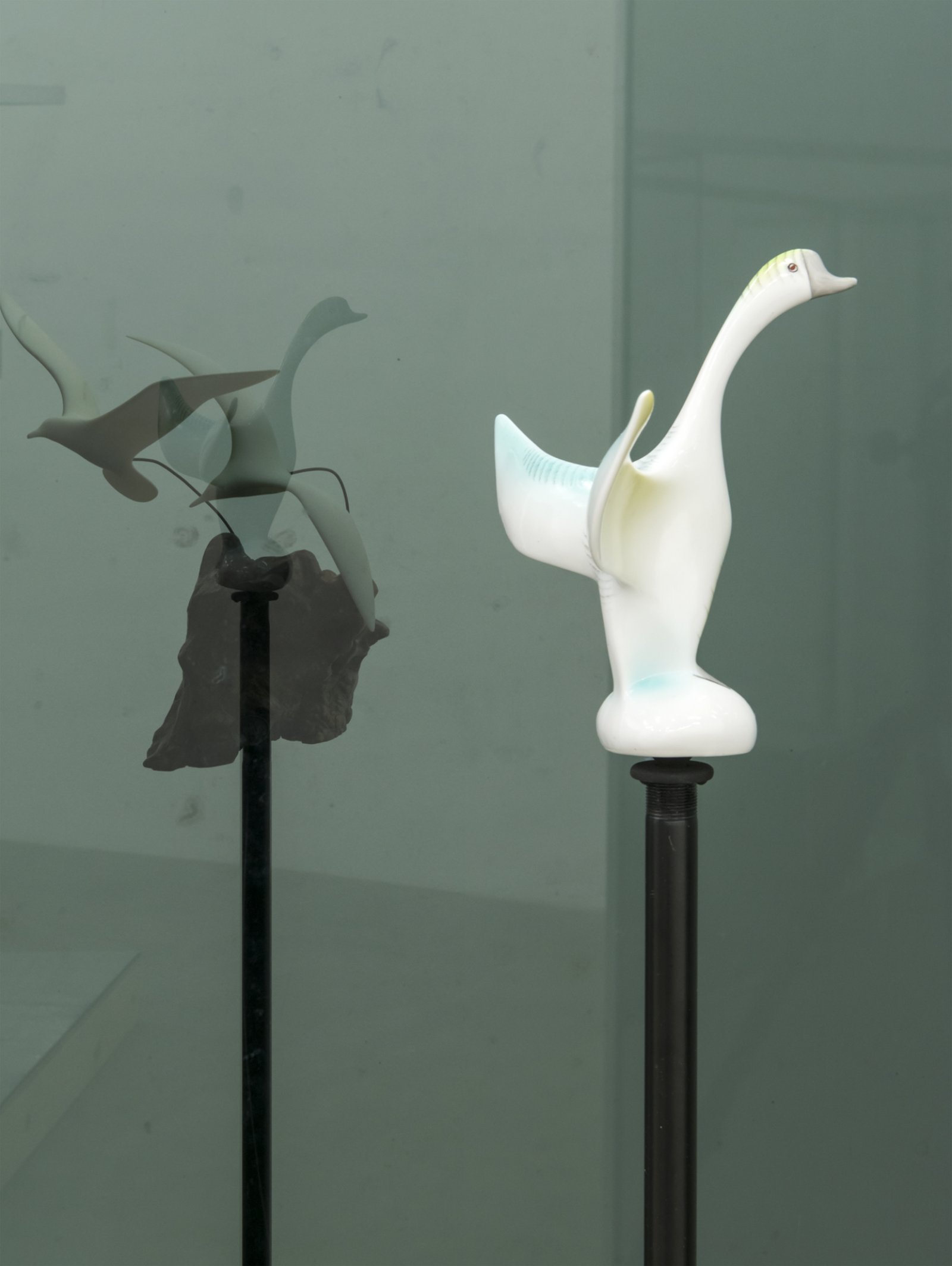 ​​Judy Radul, Connector Divider (Hawks, Sparrows, Pigeons, Doves, Ducks, Eagles) (detail), 2018, salvaged glass, aluminum, found ceramic figurines, microphone stands, dimensions variable​ by Judy Radul
