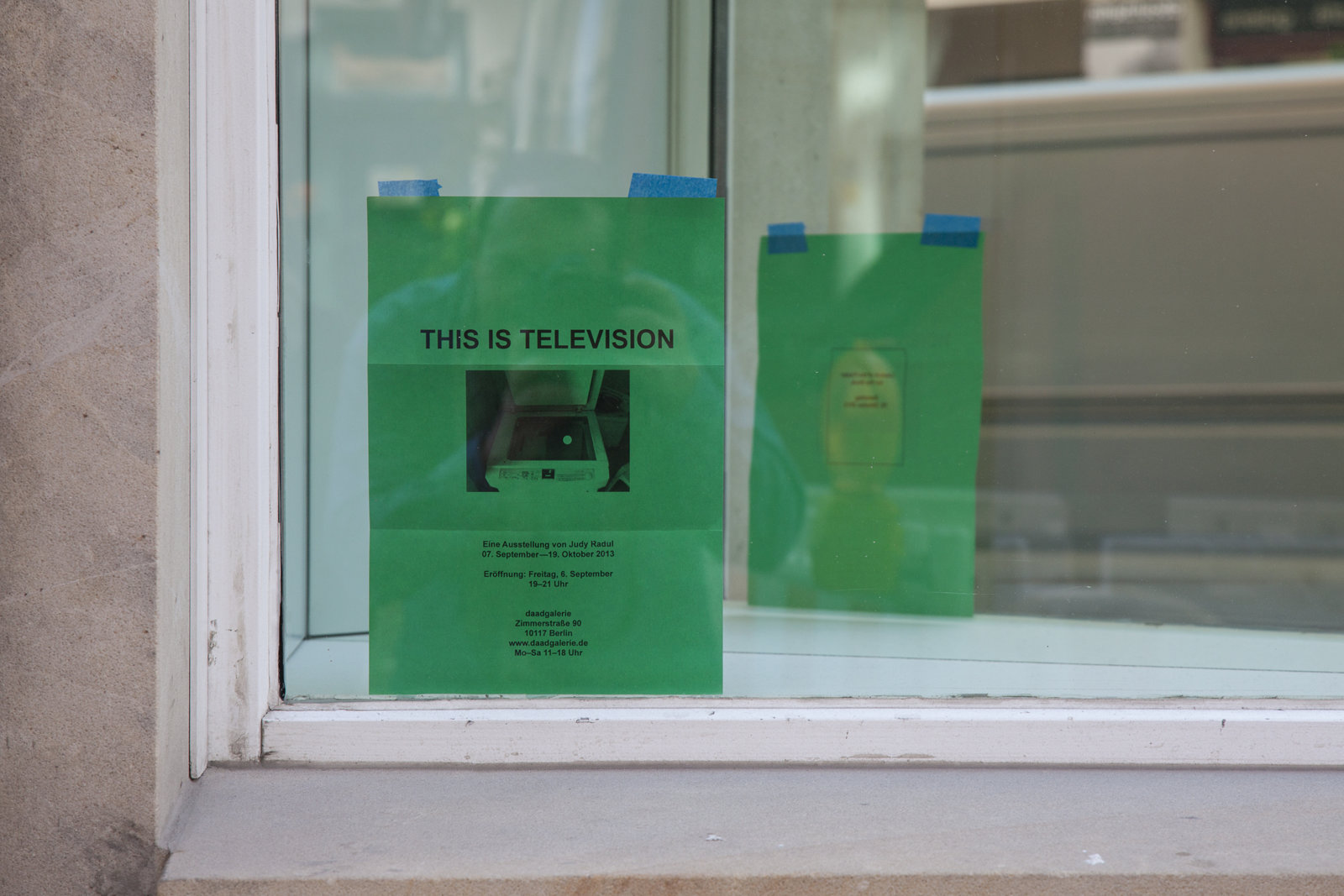 Judy Radul, EXHIBITION INVITATION (detail), 2013, mirror, black and white photocopy on green paper, dimensions variable. Installation view, This is Television, Daadgalerie, Berlin, Germany, 2013