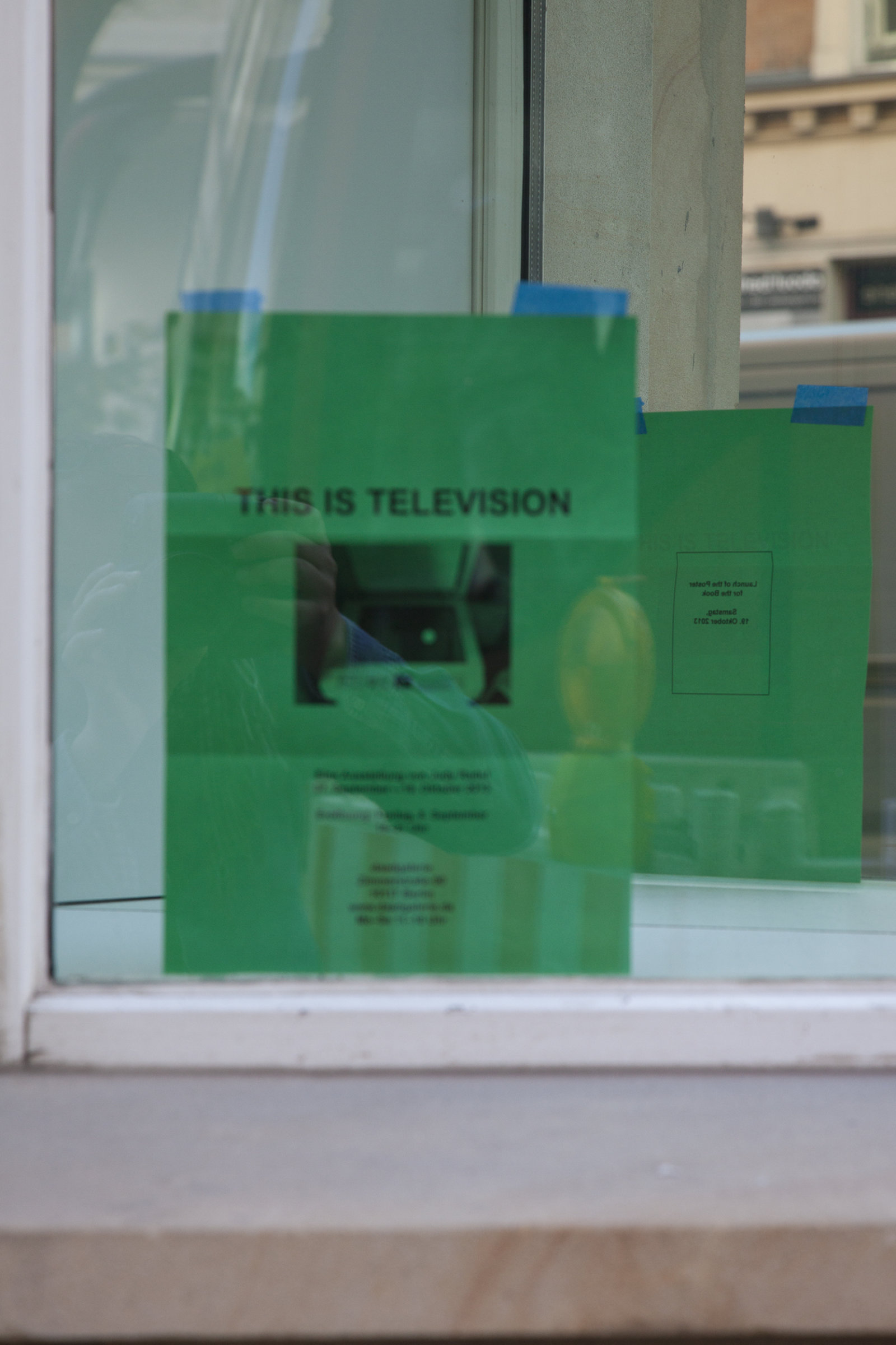 Judy Radul, EXHIBITION INVITATION (detail), 2013, mirror, black and white photocopy on green paper, dimensions variable. Installation view, This is Television, Daadgalerie, Berlin, Germany, 2013