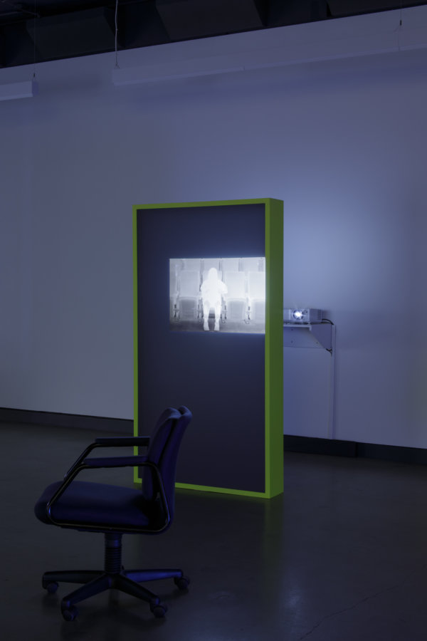 Judy Radul, Warmer Than The World Around Us (Heated Seats), 2023, video projection of thermographic recording, PVC screen, painted wood and MDF, 11 minutes, 3 seconds, 76 x 41 x 8 in. (193 x 105 x 20 cm)﻿