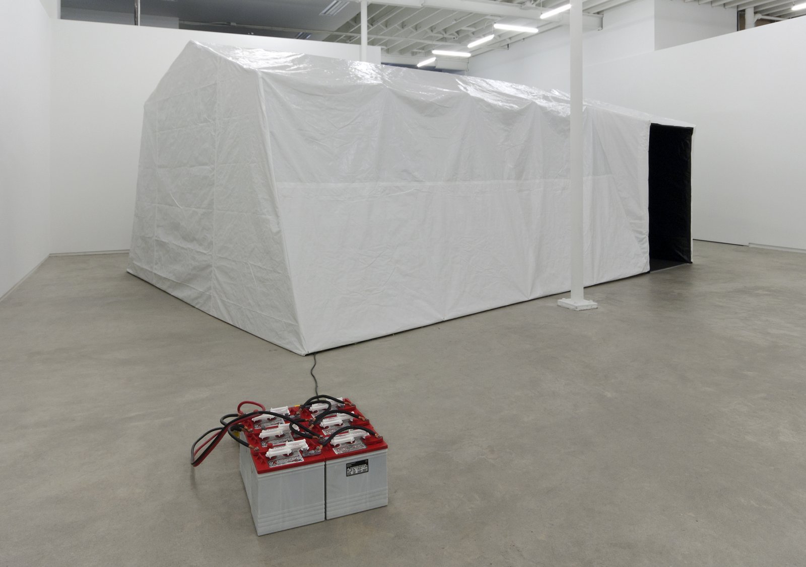 Kevin Schmidt, Autonomous Projection Room #1, 2010, tarp, portable garage frame, carpet, roxul, projector, home stereo system, screen, batteries, inverter, camping chairs, 181 x 60 x 105 in. (460 x 152 x 267 cm) by Kevin Schmidt