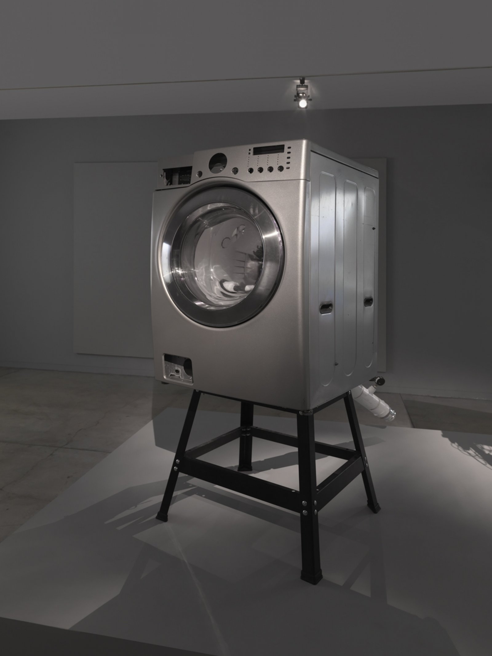 Kevin Schmidt, How to Make an Off-Grid Hydroelectric Light Show, 2018, 2-channel video, direct-drive washing machine, hose, cables, battery, inverter, modular synthesizer, lights, set of instructional videos on youtube, dimensions variable. Installation view, We Are the Robots, Vancouver Art Gallery, Vancouver, 2018